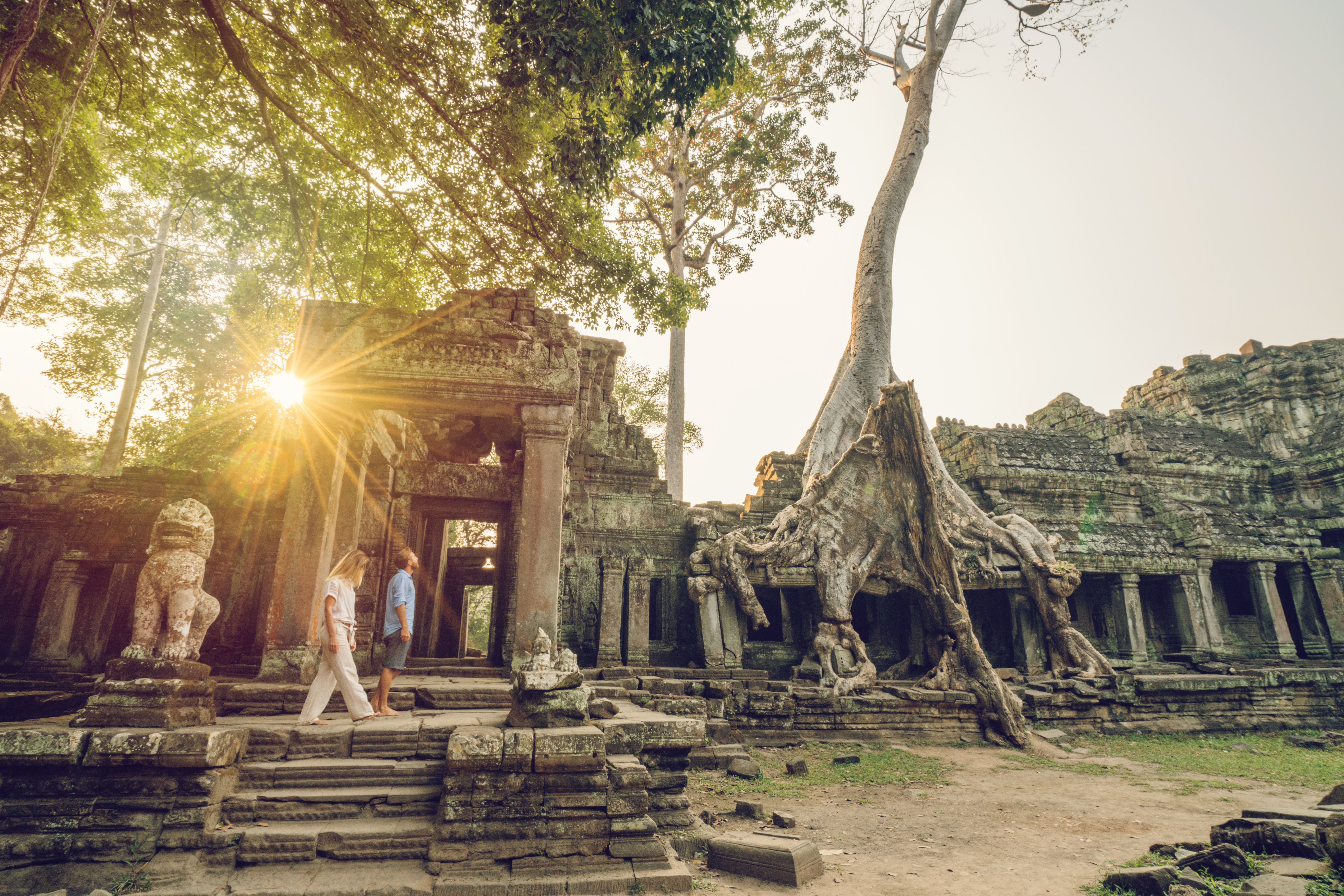 Angkor Wat Young couple traveling in Cambodia visiting the temples of Angkor wat complex