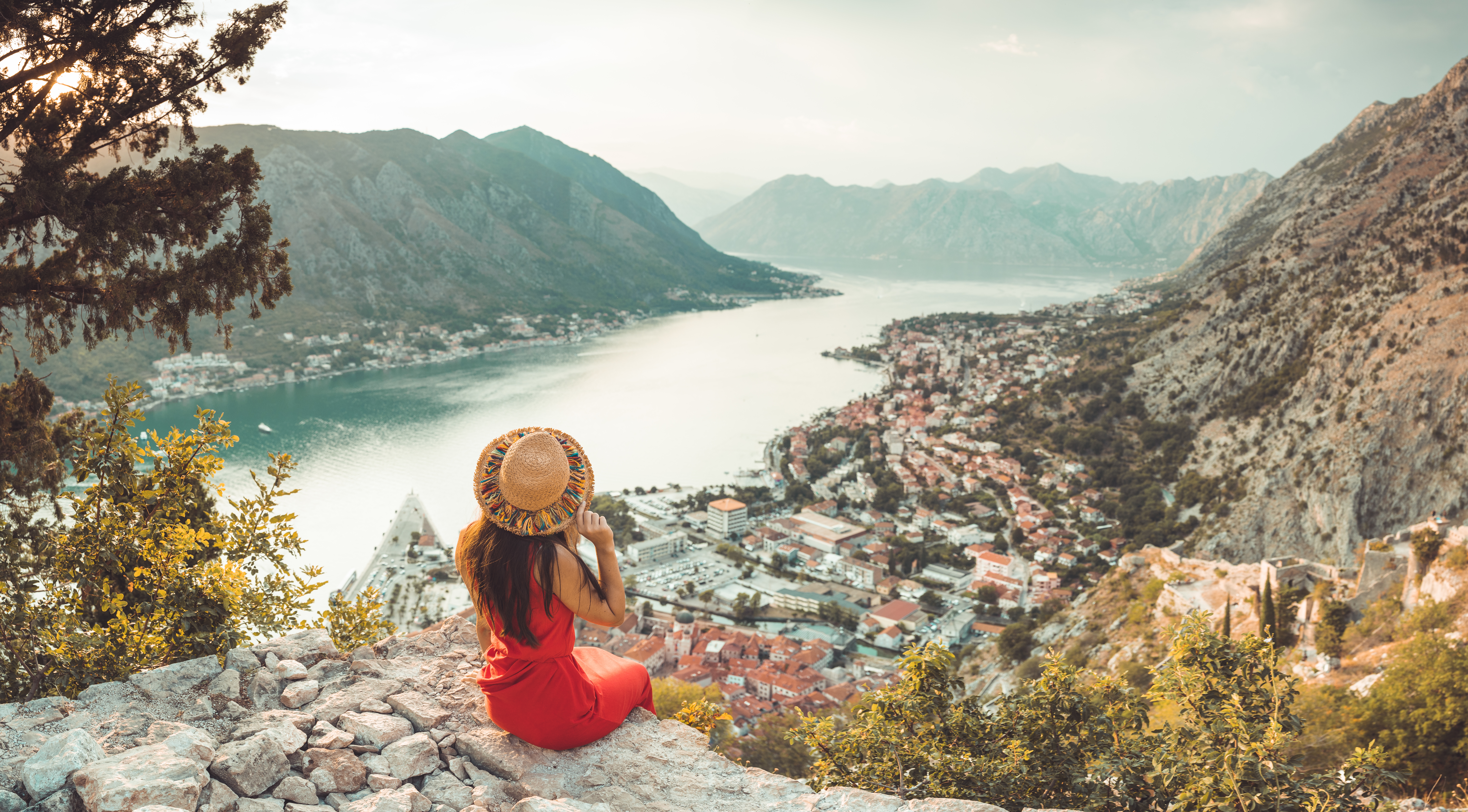 Tourist looking over edge at Kotor, Montenegro 