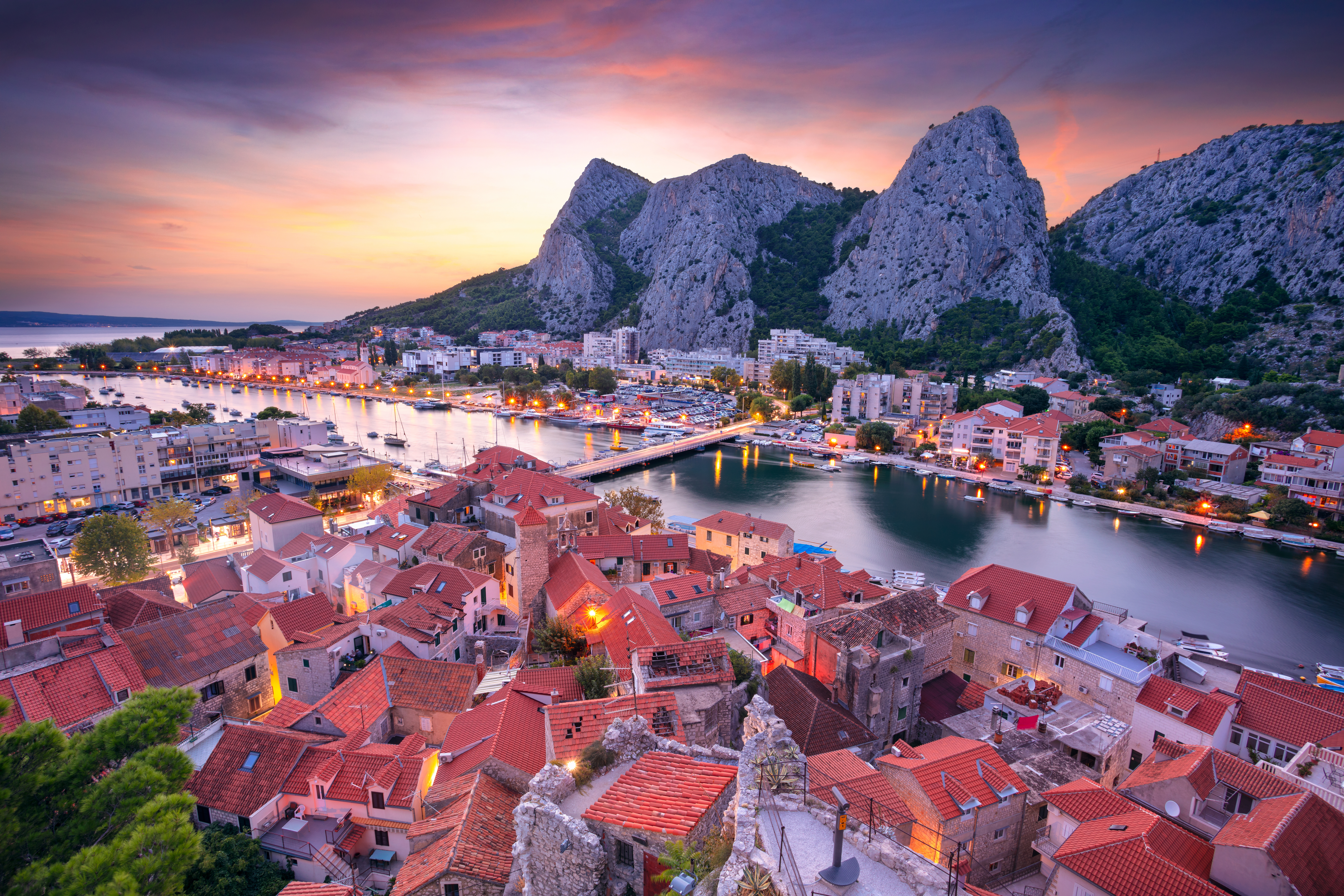 Cityscape image of beautiful coastal town Omis, Dalmatia, Croatia at summer sunset
