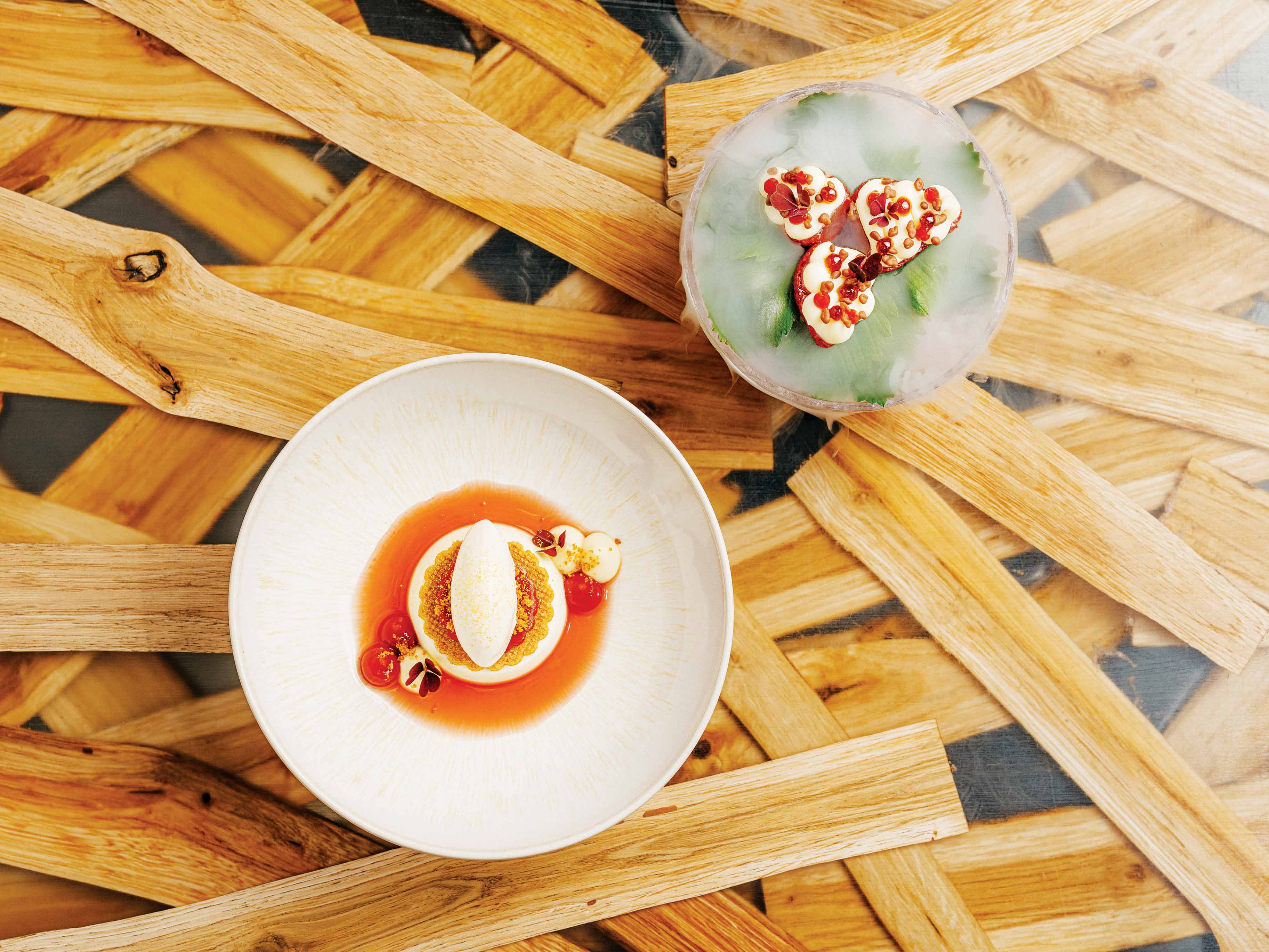 An overhead view of two pristinely prepared dishes of aromatic strawberries at 420 in Prague.