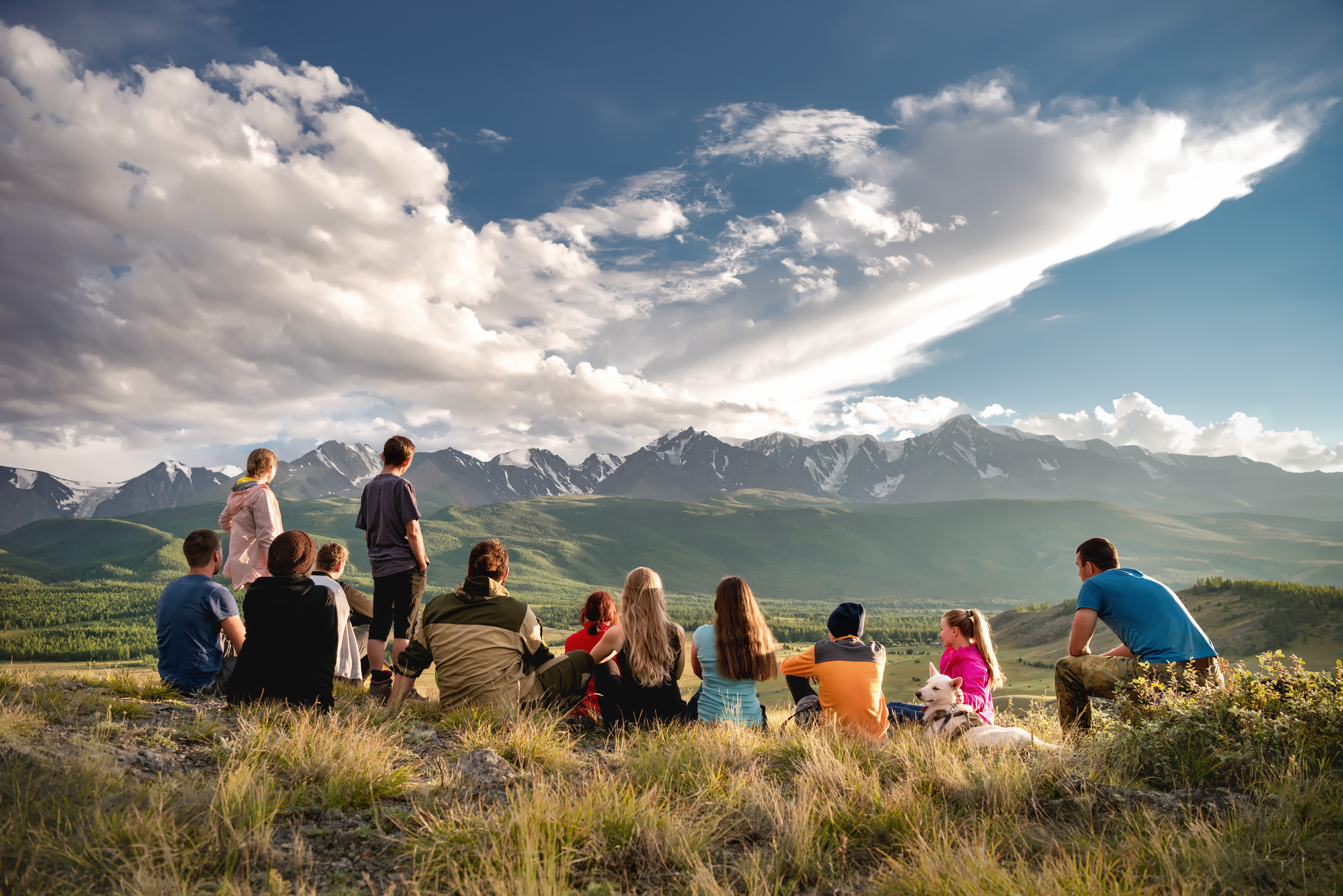 Big group of tourists are sitting in mountains