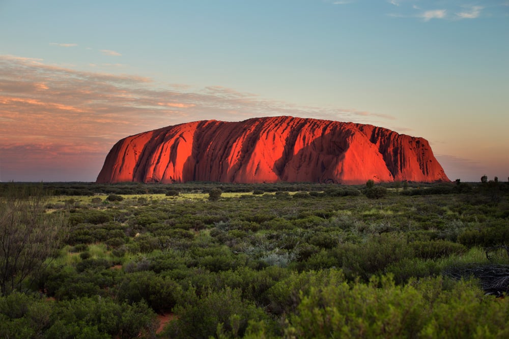 Wide shot of Uluru at sunset
