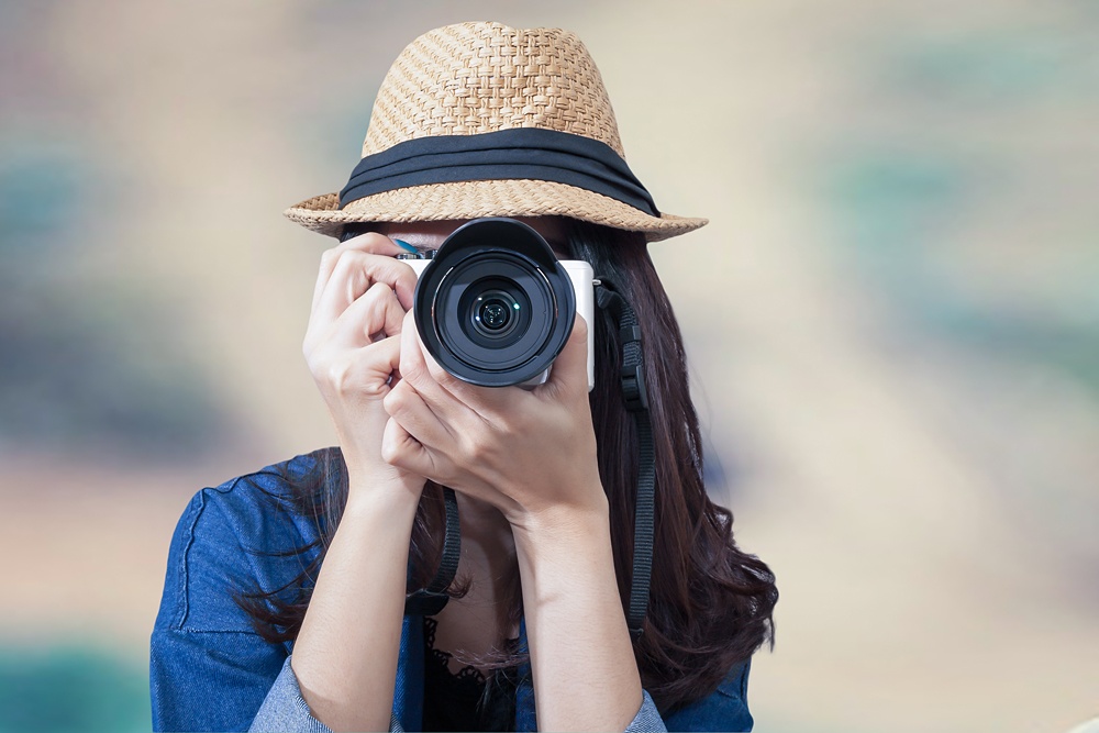 Female traveller taking a photograph