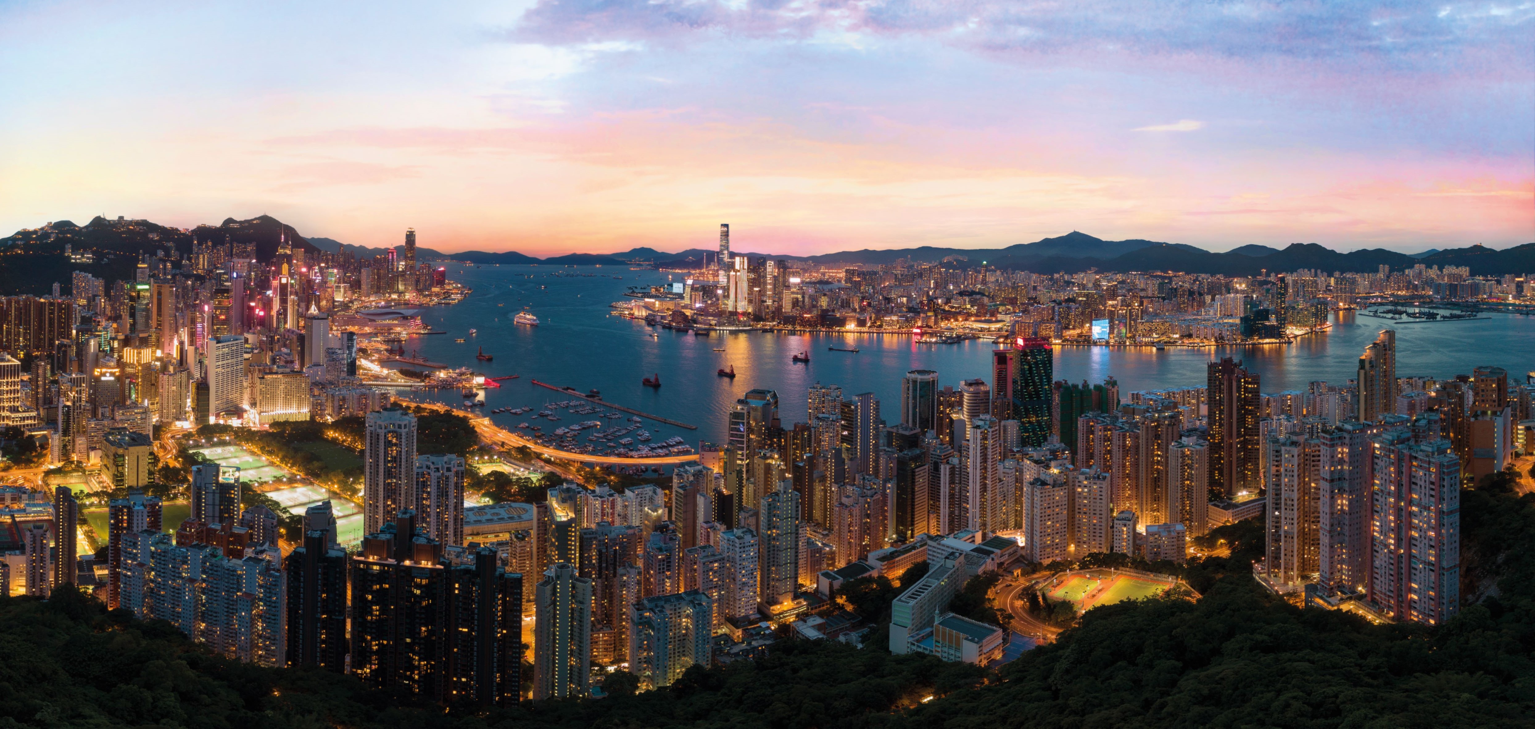 The skyline of Hong Kong creates an unforgettable panoramic view of the harbour and skyscrapers.