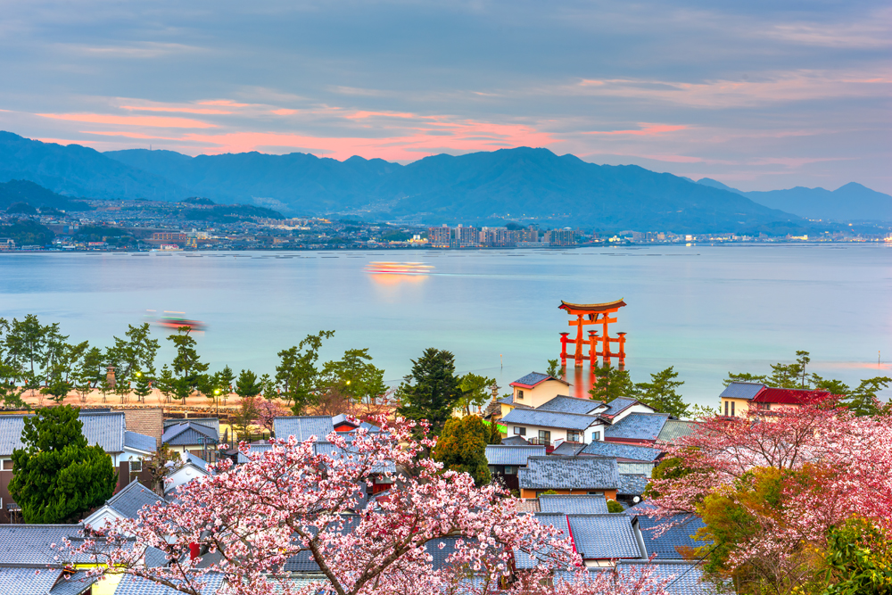 Temples on the Seto Inland Sea at dusk in the spring season, Miyajima Island, Hiroshima, Japan