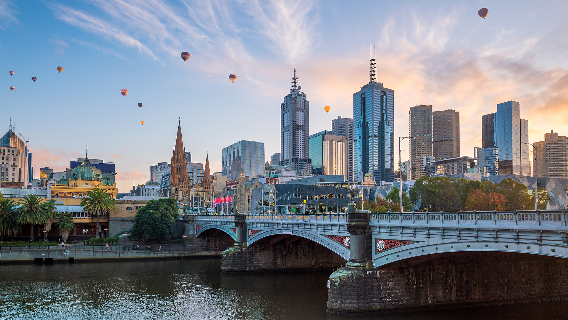 Hot air balloons floating over Melbourne and Yarra River