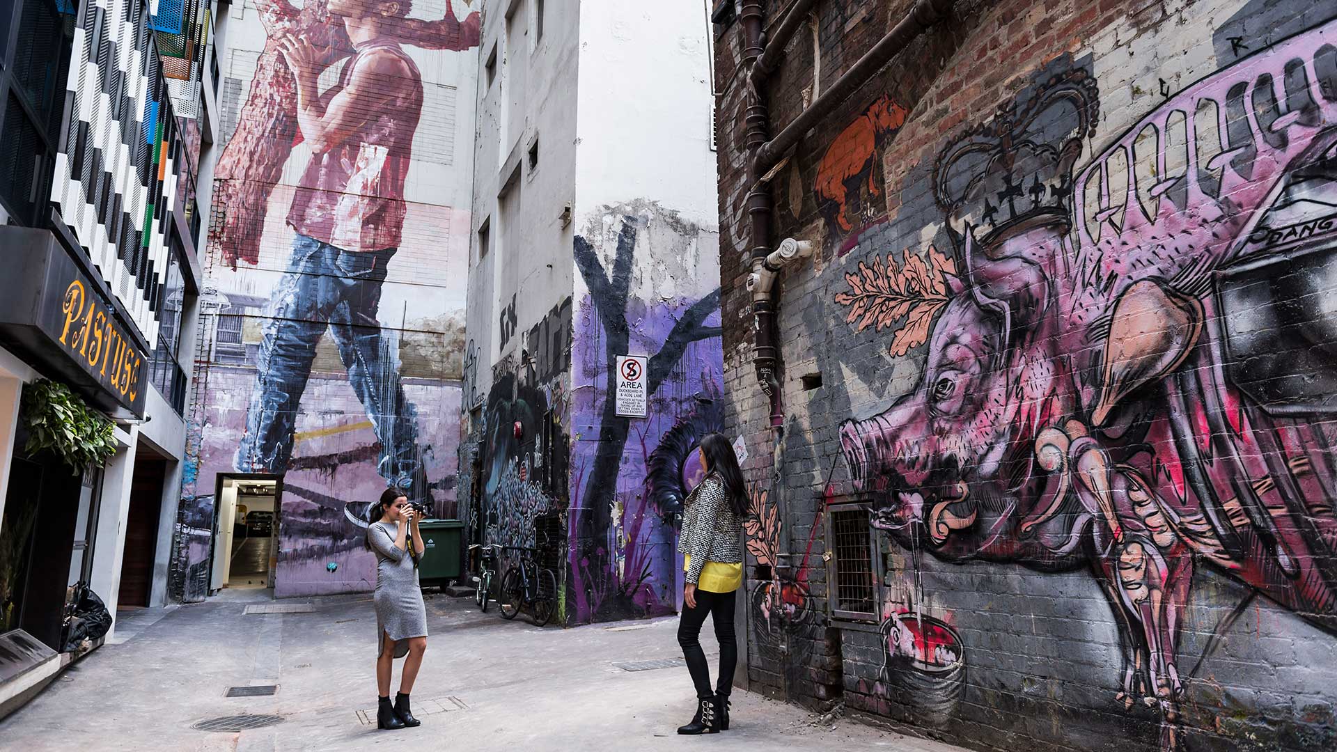 alley with graffiti artwork covering walls