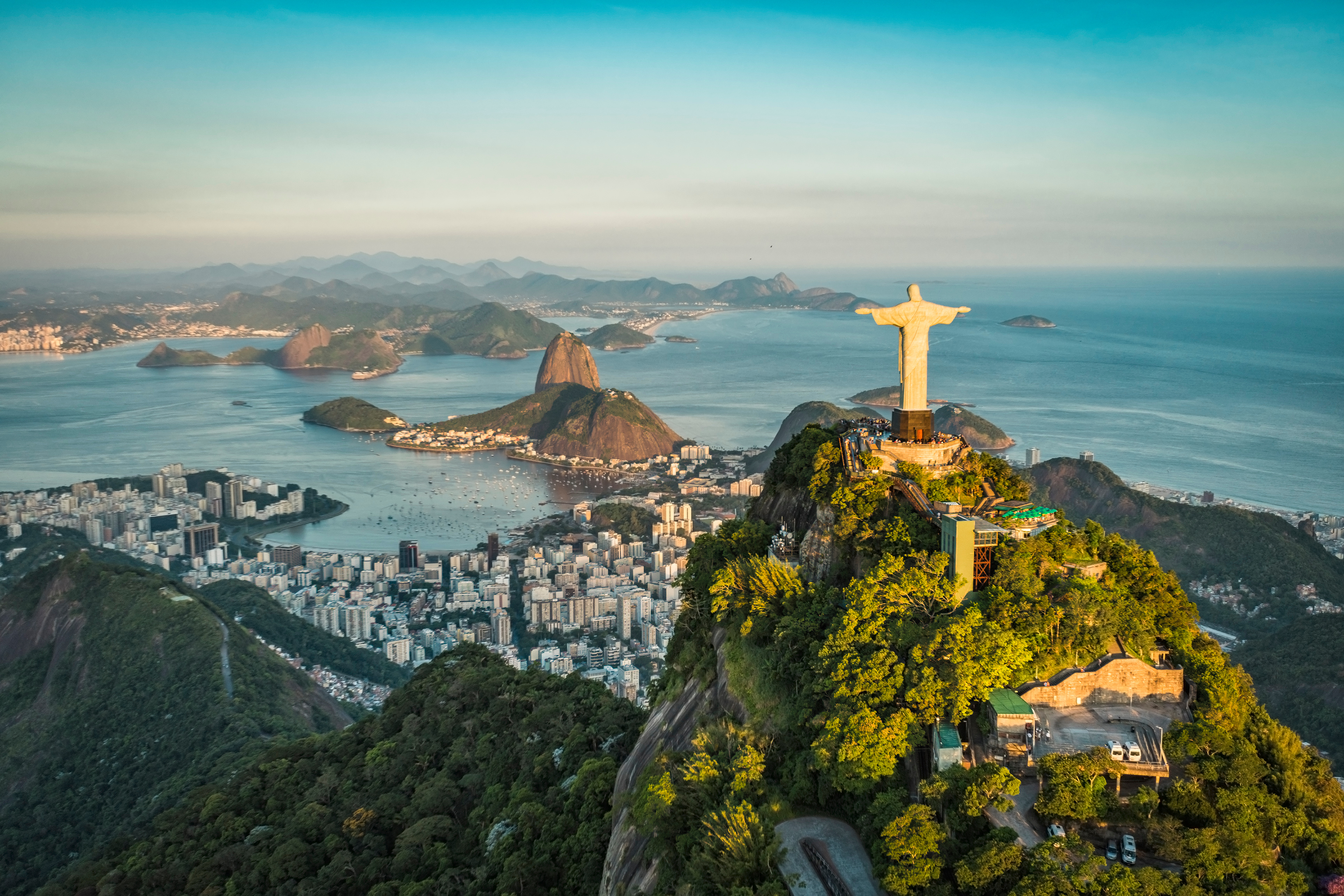aerial view of Christ the Redeemer watching over Rio de Janeiro from his benevolent perch above the city