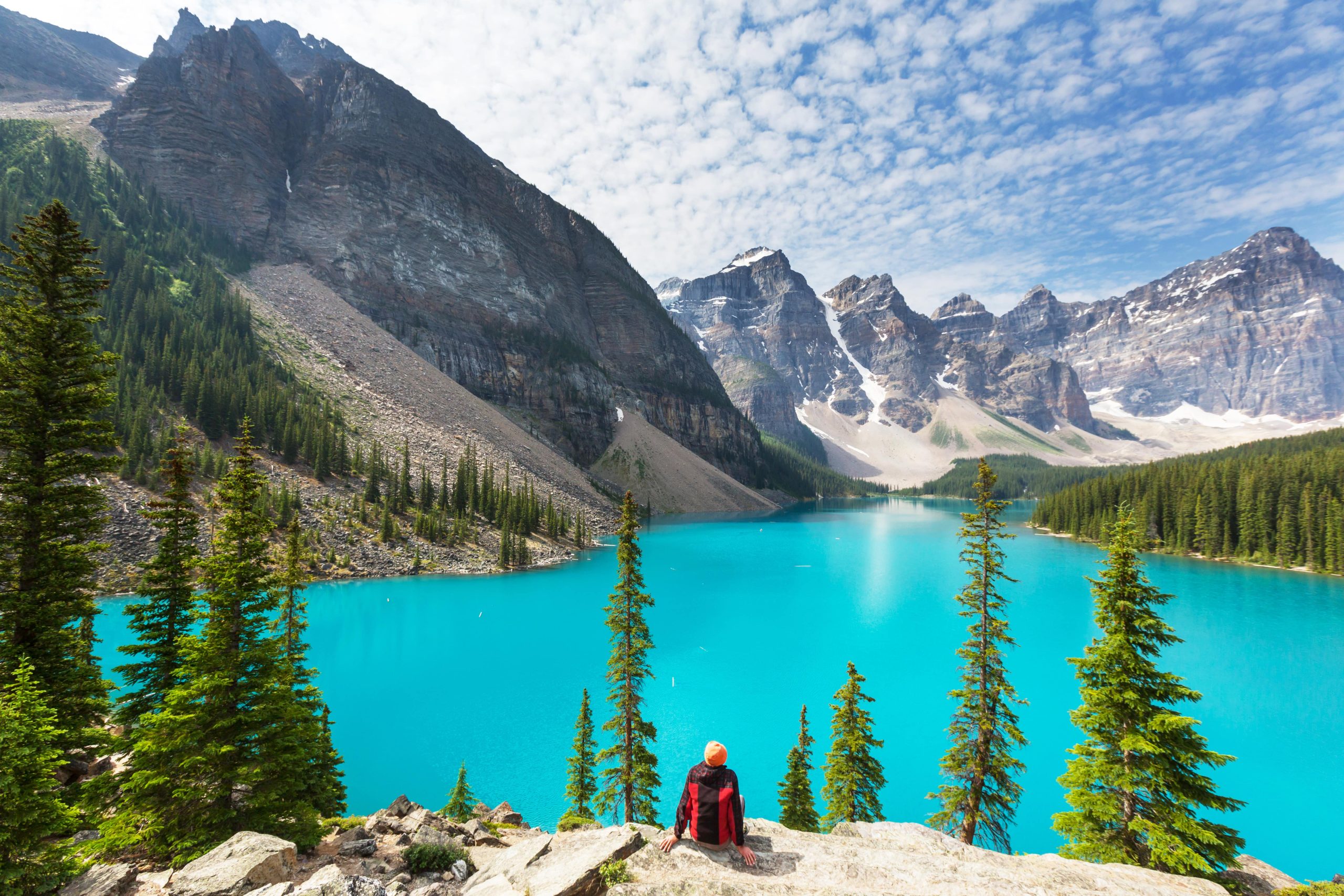 view of blue lake with mountains in back