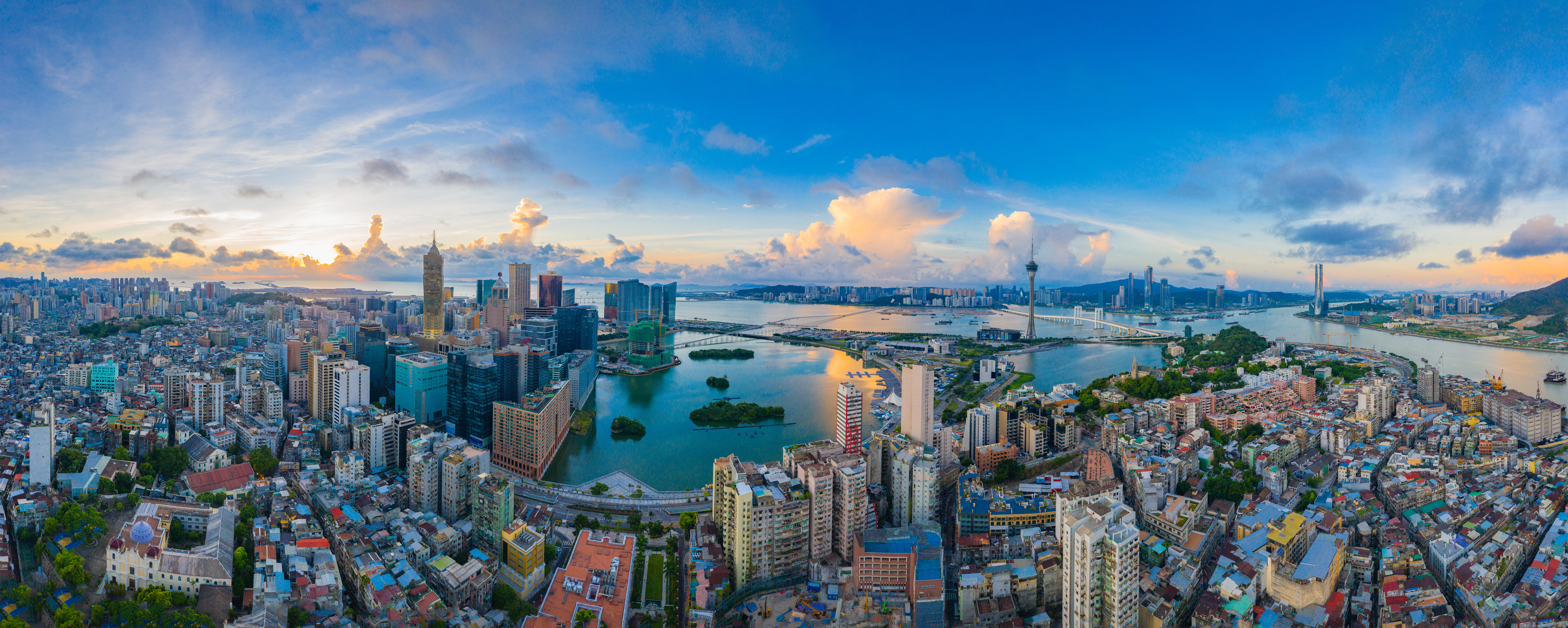 aerial view of a sprawling peninsula city next to the water