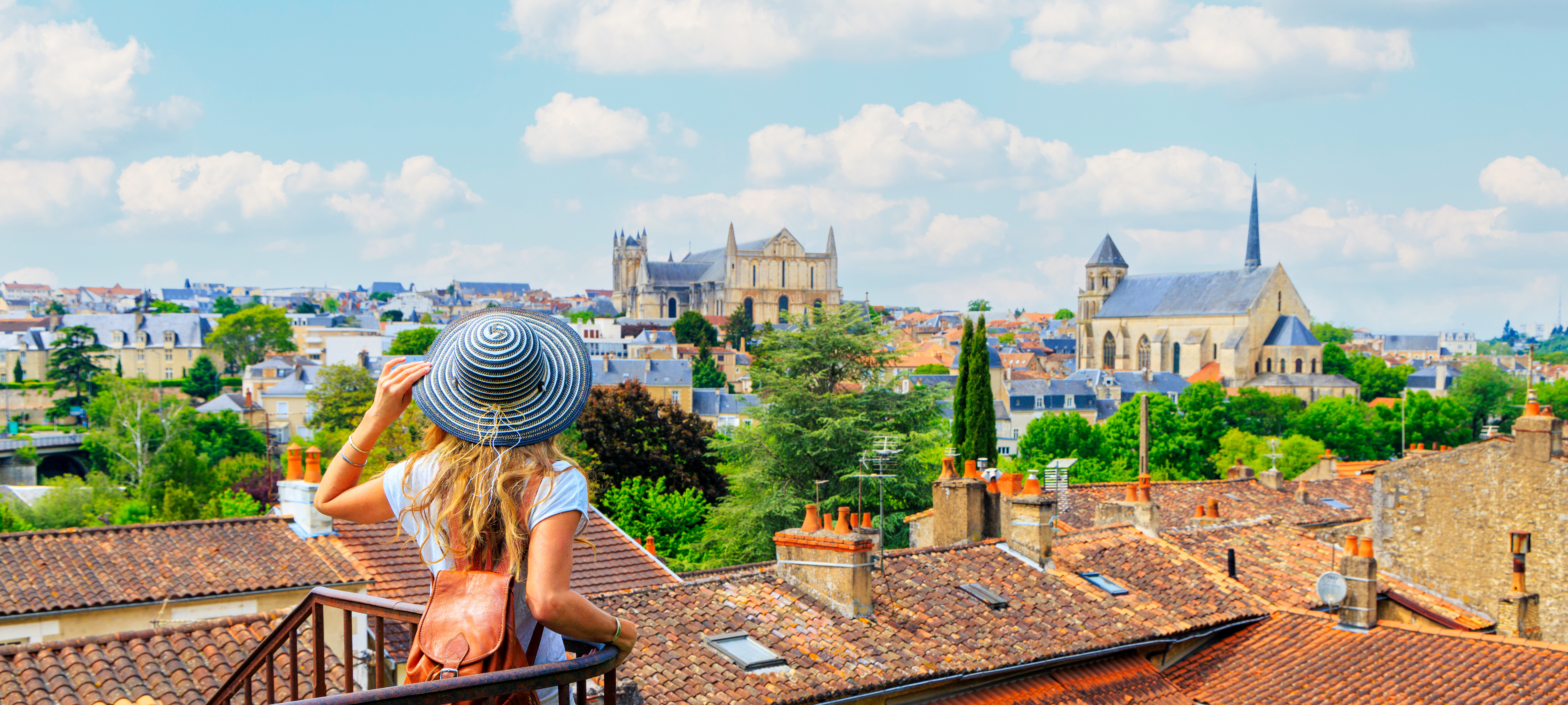 Poitiers city landscape- Woman looking at urban skyline- France