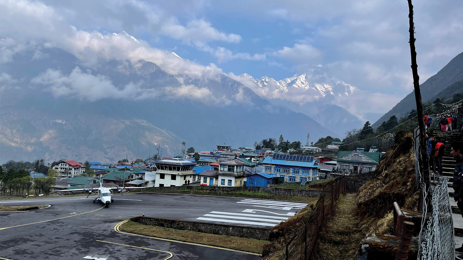 airport with mountains in background and small city