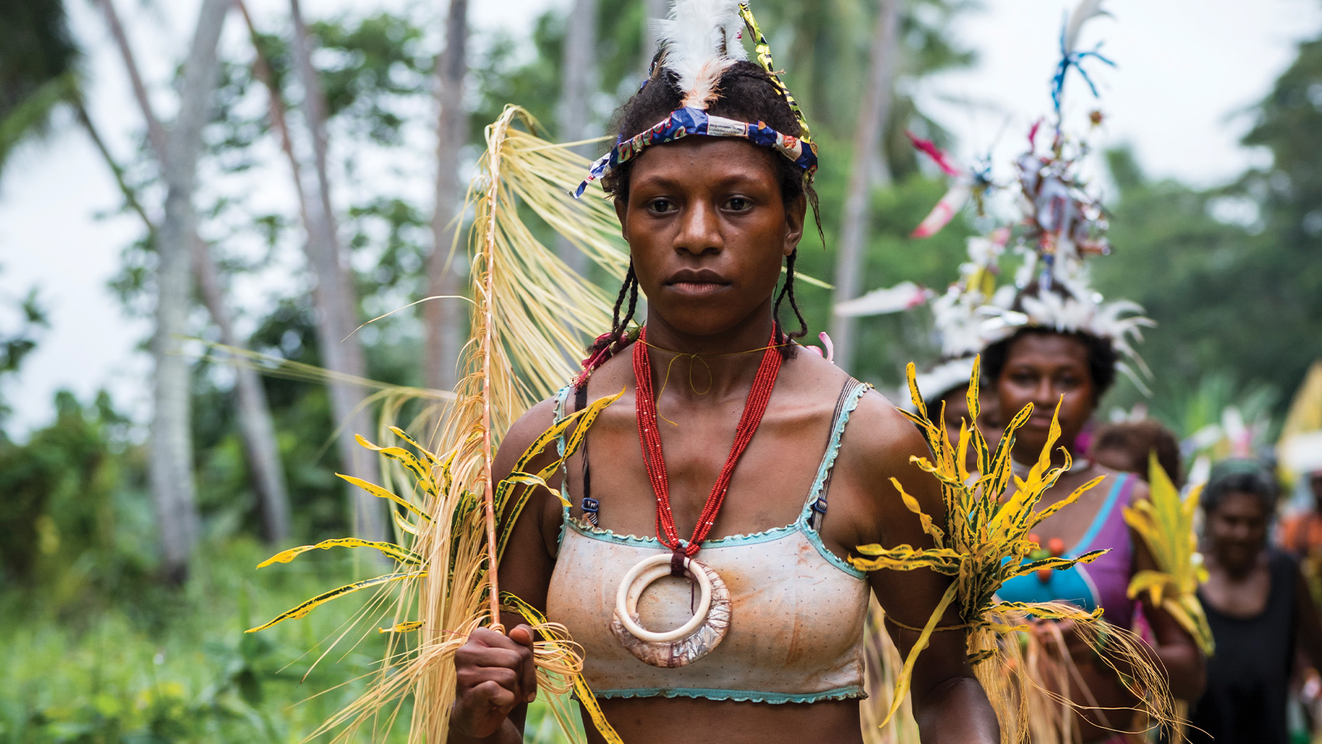 woman in Papua New Guinea dressed in traditional outfit