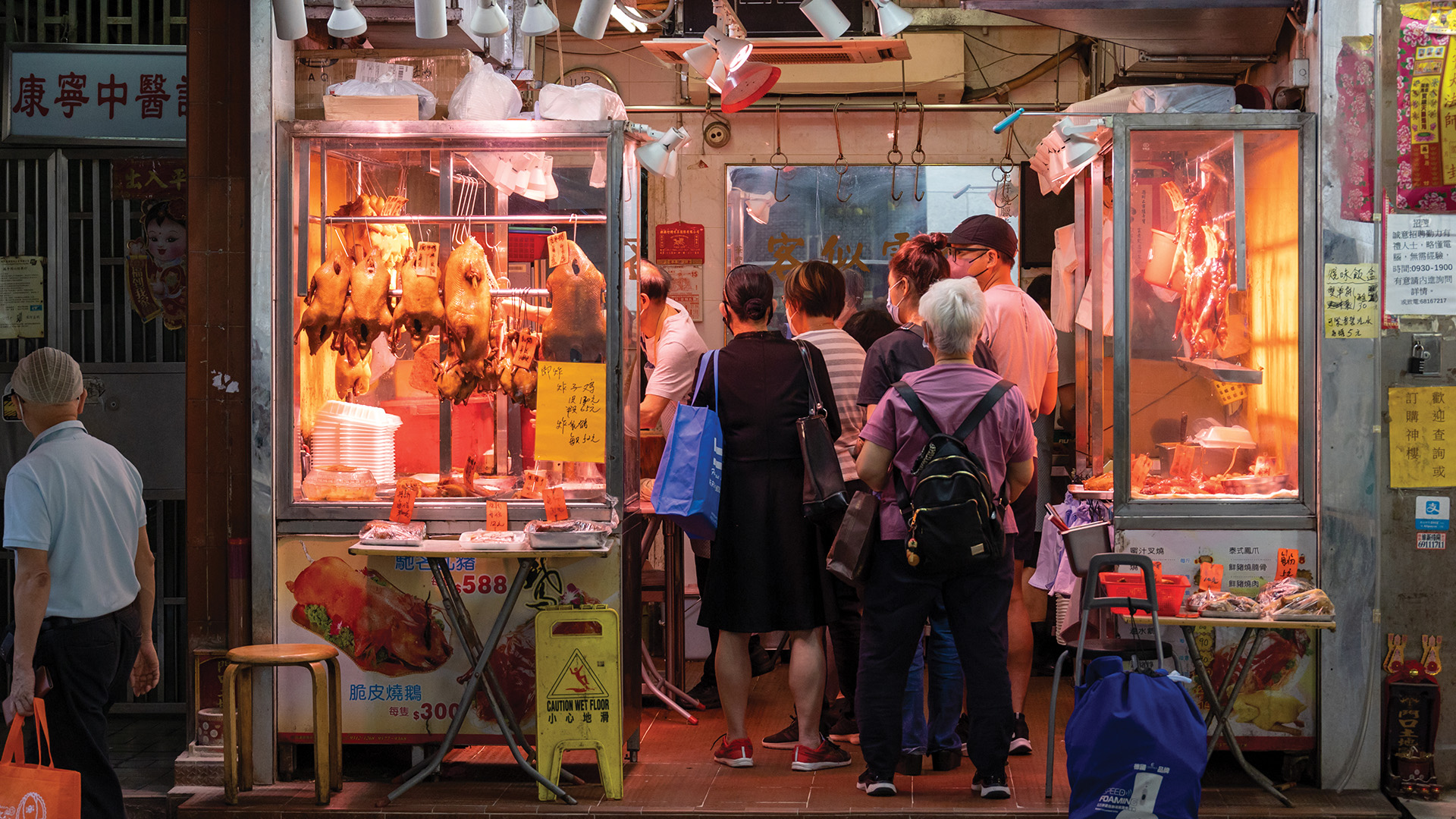 Patrons lining up inside a Hong Kong goose restaurant