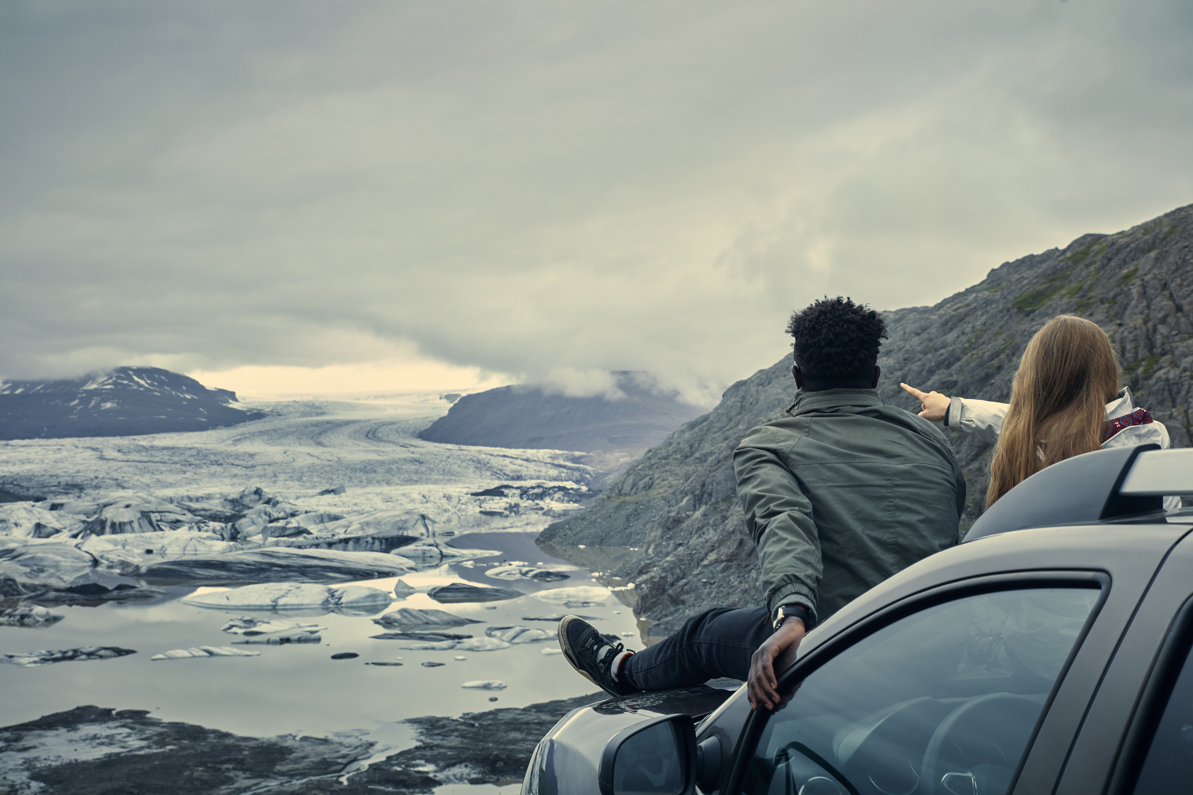 Couple relaxing during road trip. Looking at view