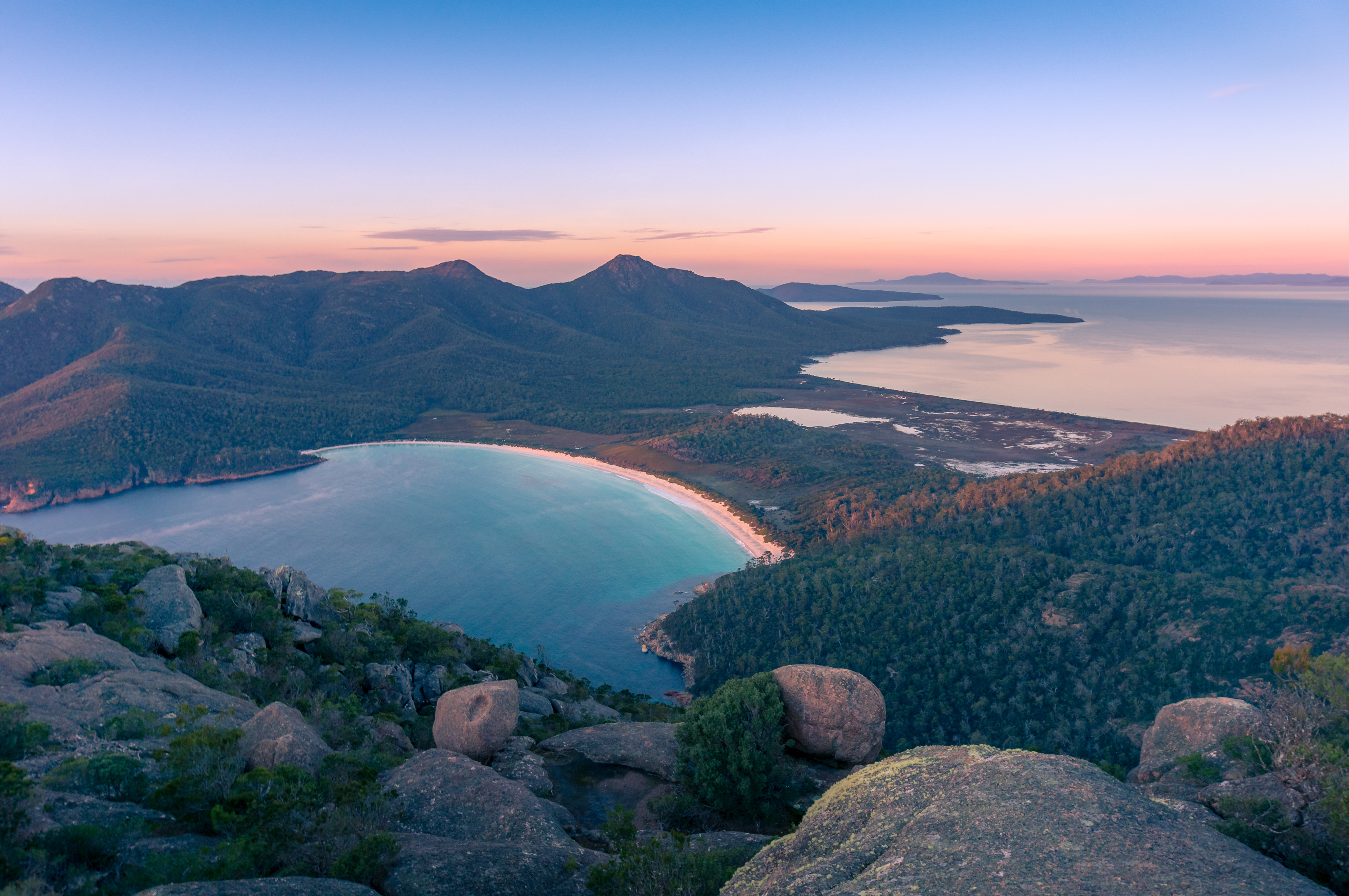 Sunrise landscape of beautiful bay and mountains. Wineglass bay in Freycinet National Park, Tasmania, Australia