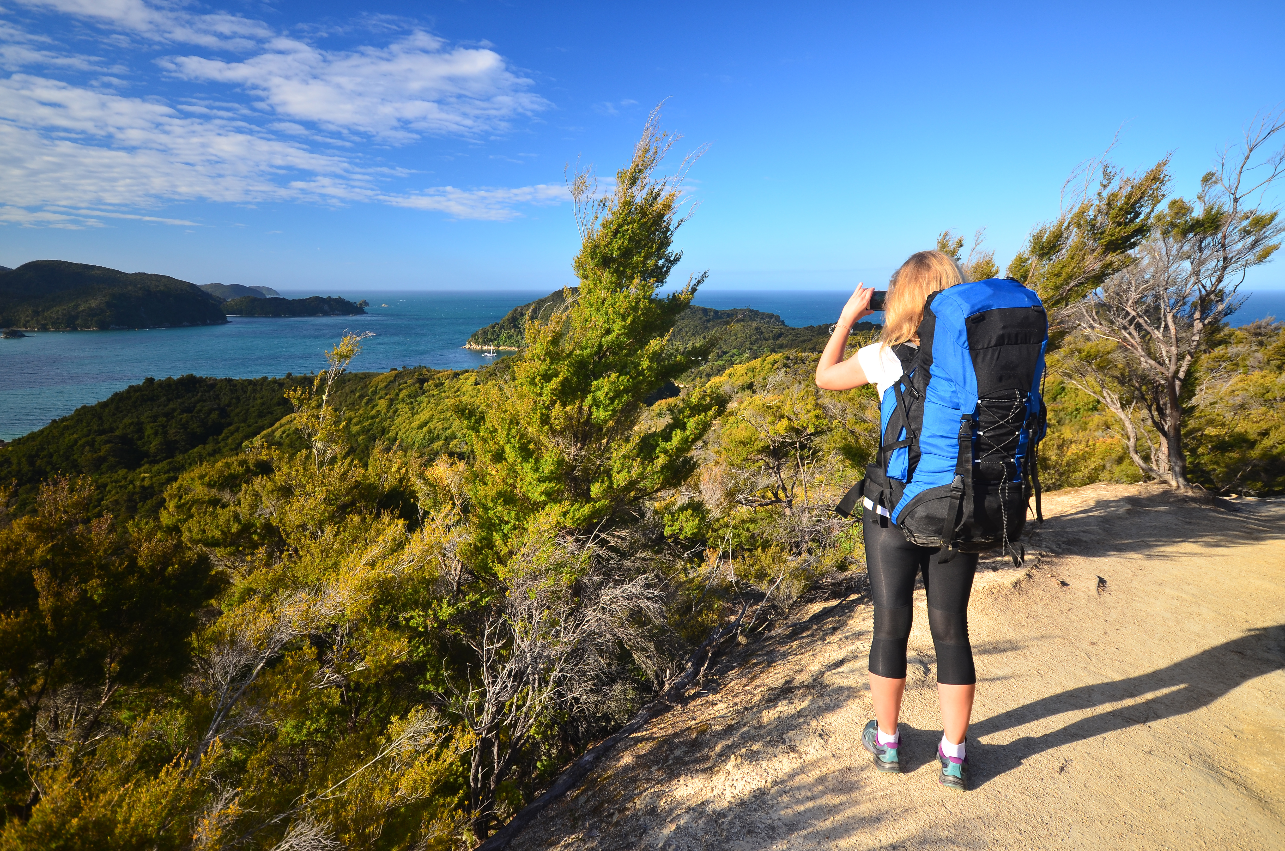 Hiker taking picture in Abel Tasman National Park