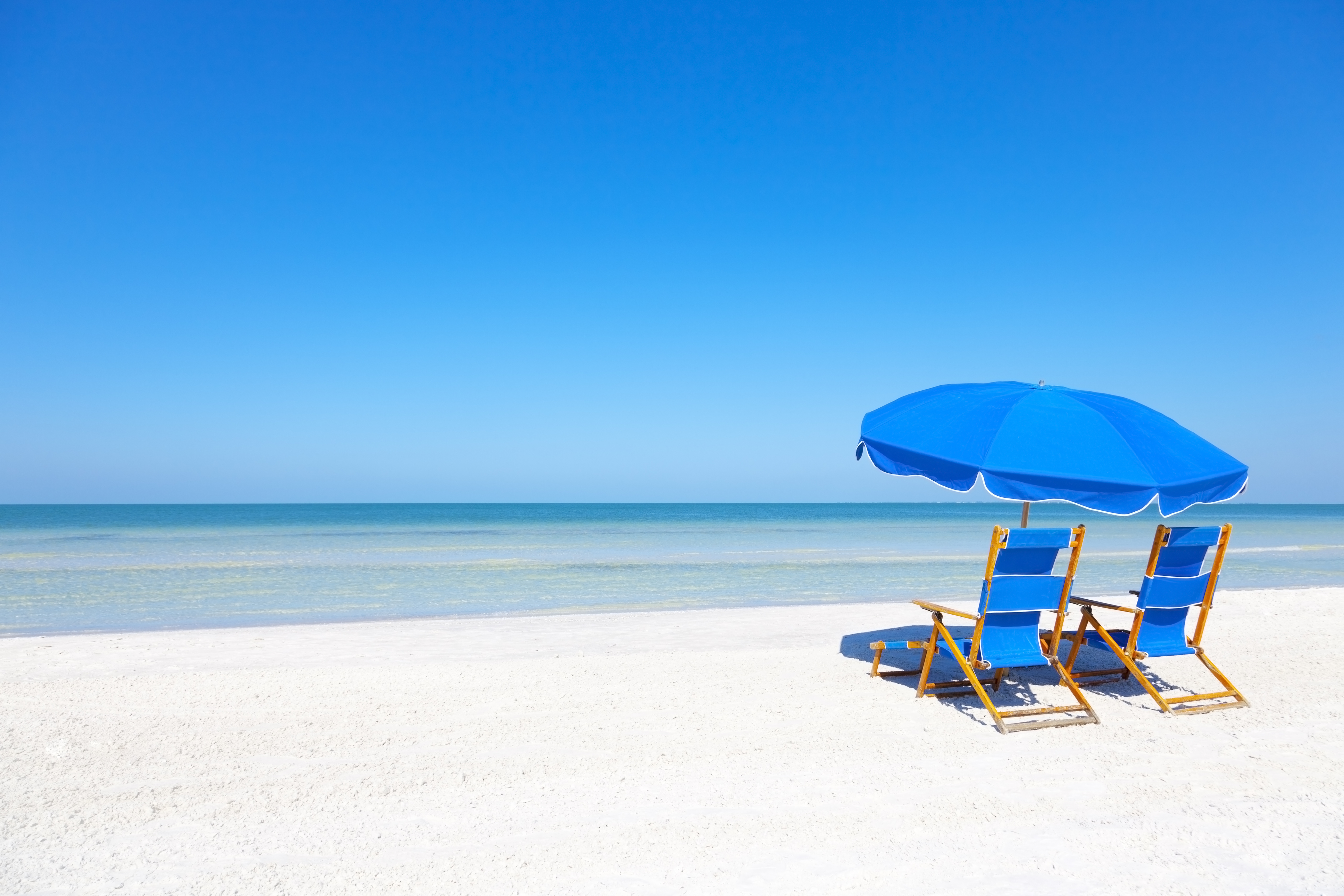 Lounge Chairs and Umbrella at the Beach