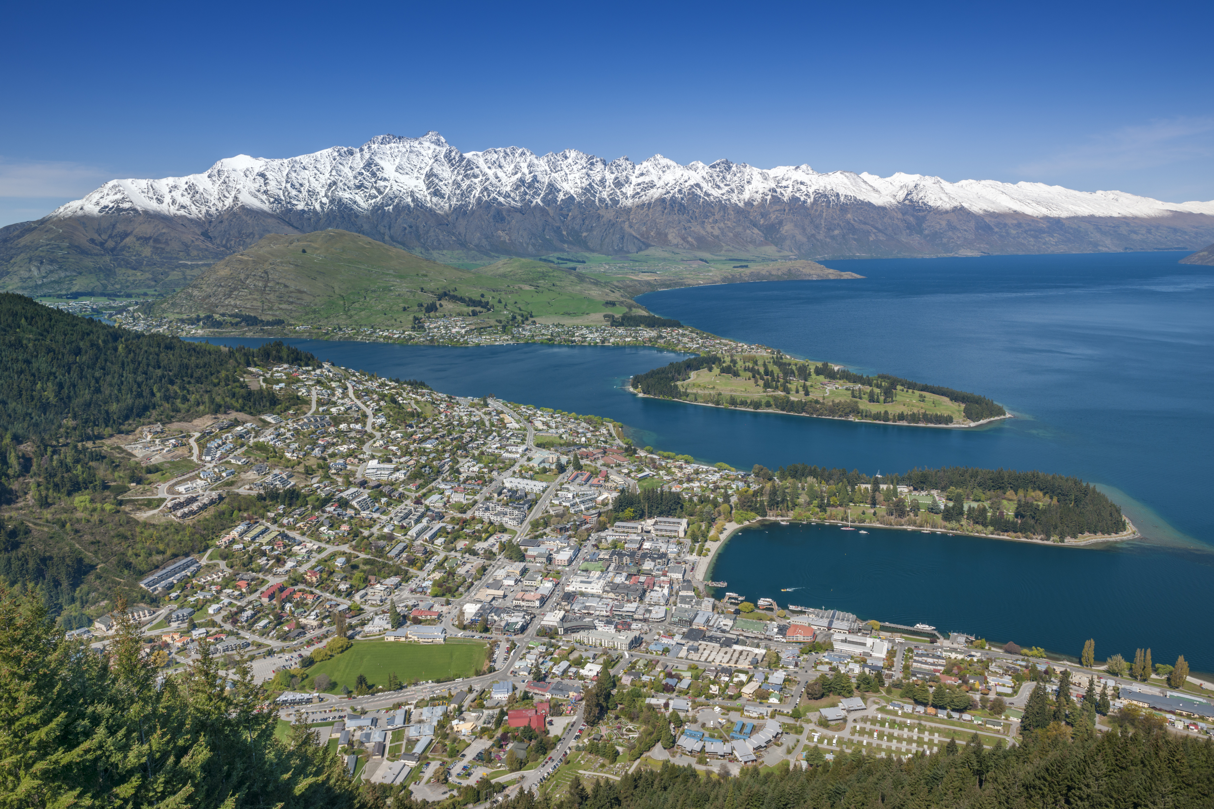 Queenstown and The Remarkables Panorama, Otago, New Zealand. Spring has just started and the peaks of the Remarkables in back got their last powder snow.