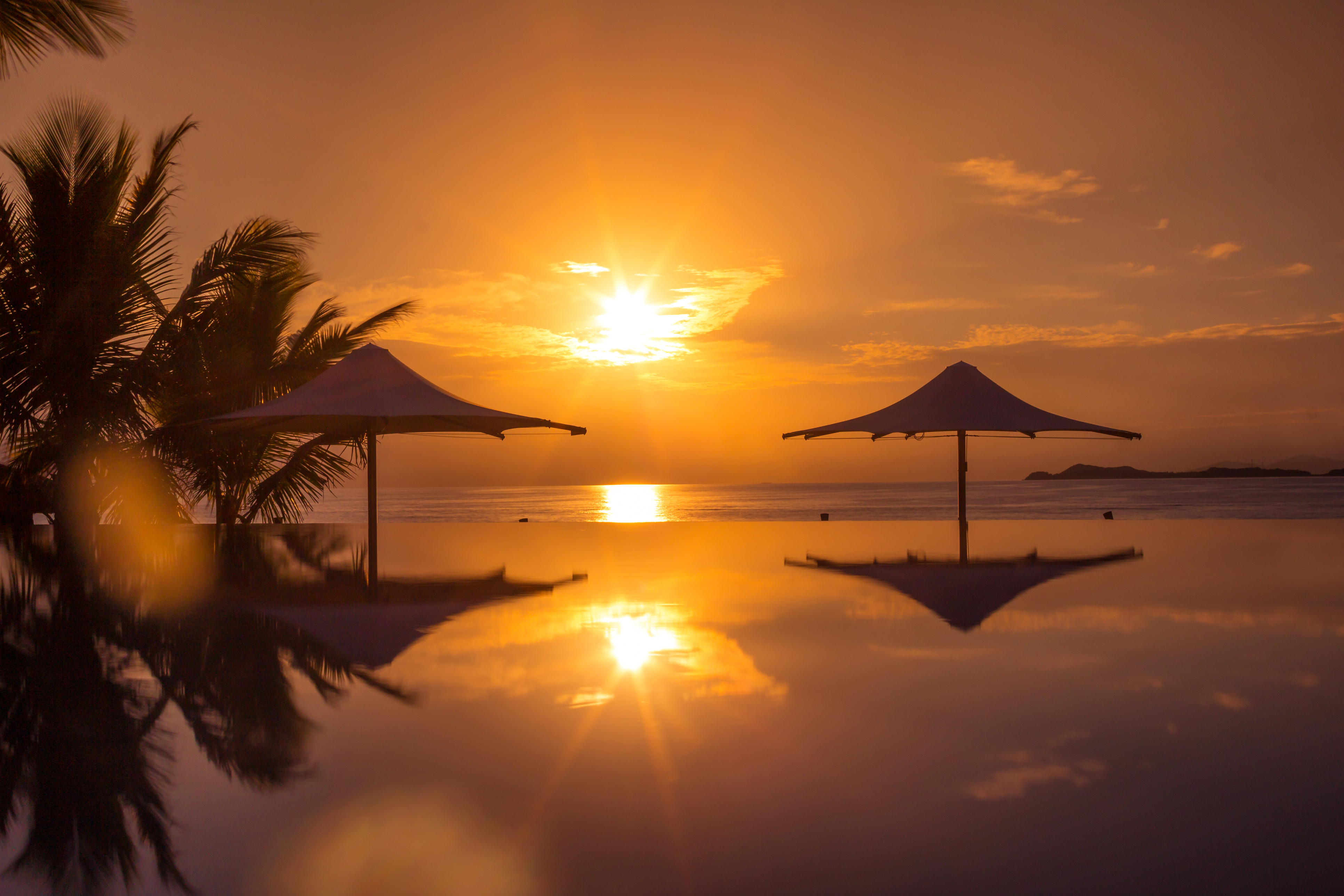Tropical Fijian swimming pool at sunrise