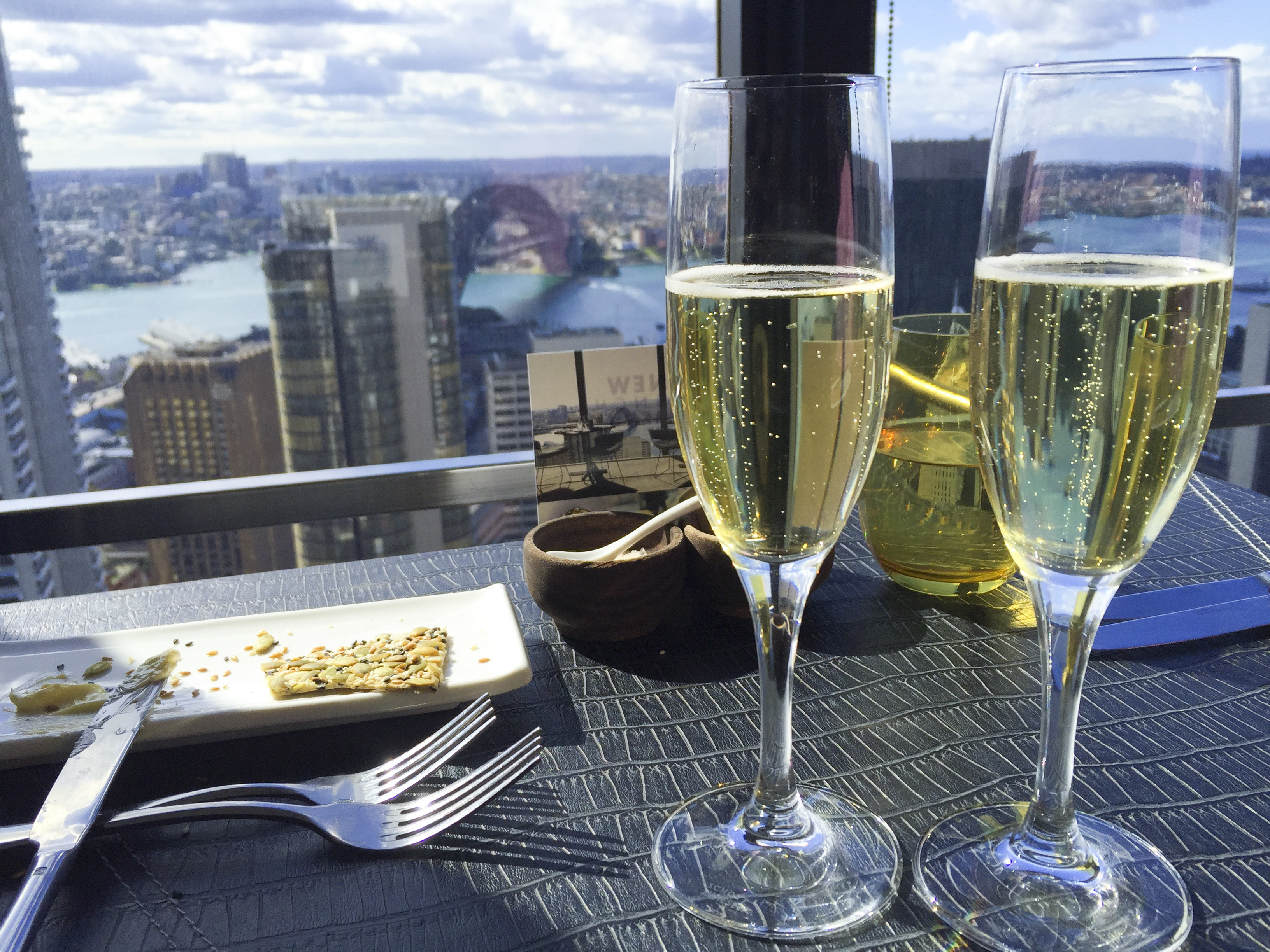 Champagne and a snack in a high rise building. 