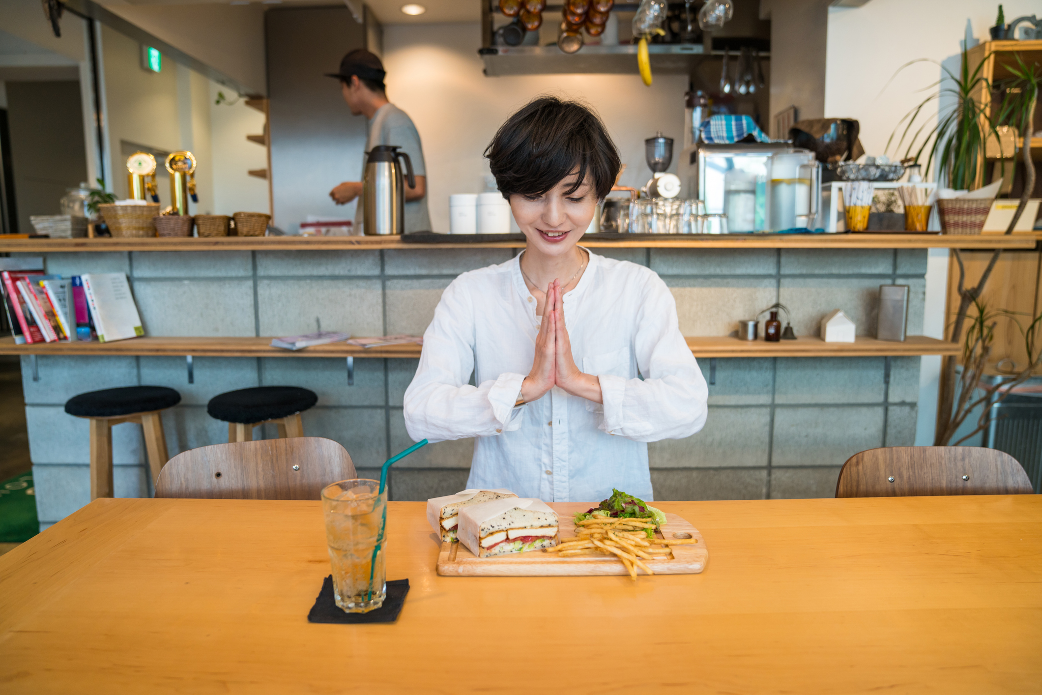 Woman about to enjoy lunch in a cafe