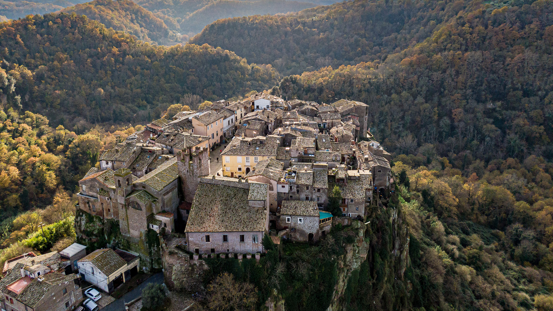 overhead view of medieval town on cliff top