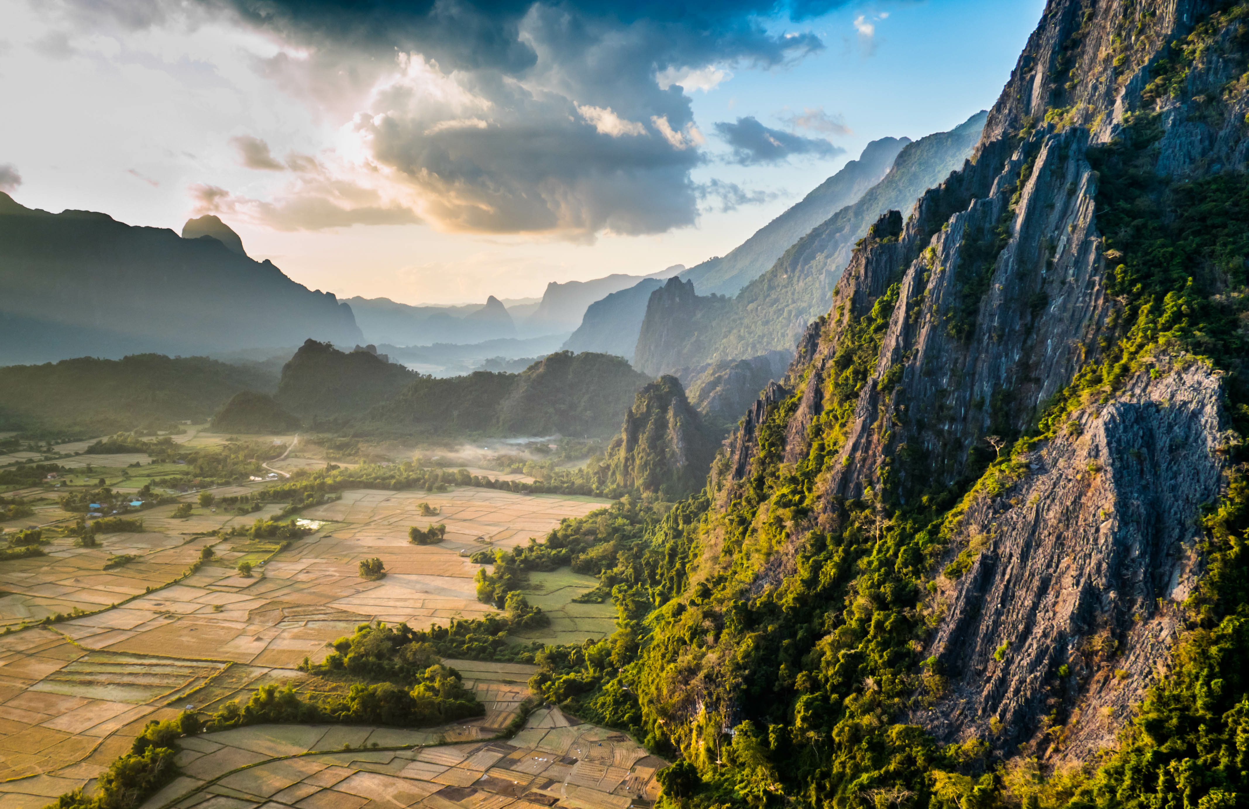 A view of the lush mountains and rice paddies of Laos