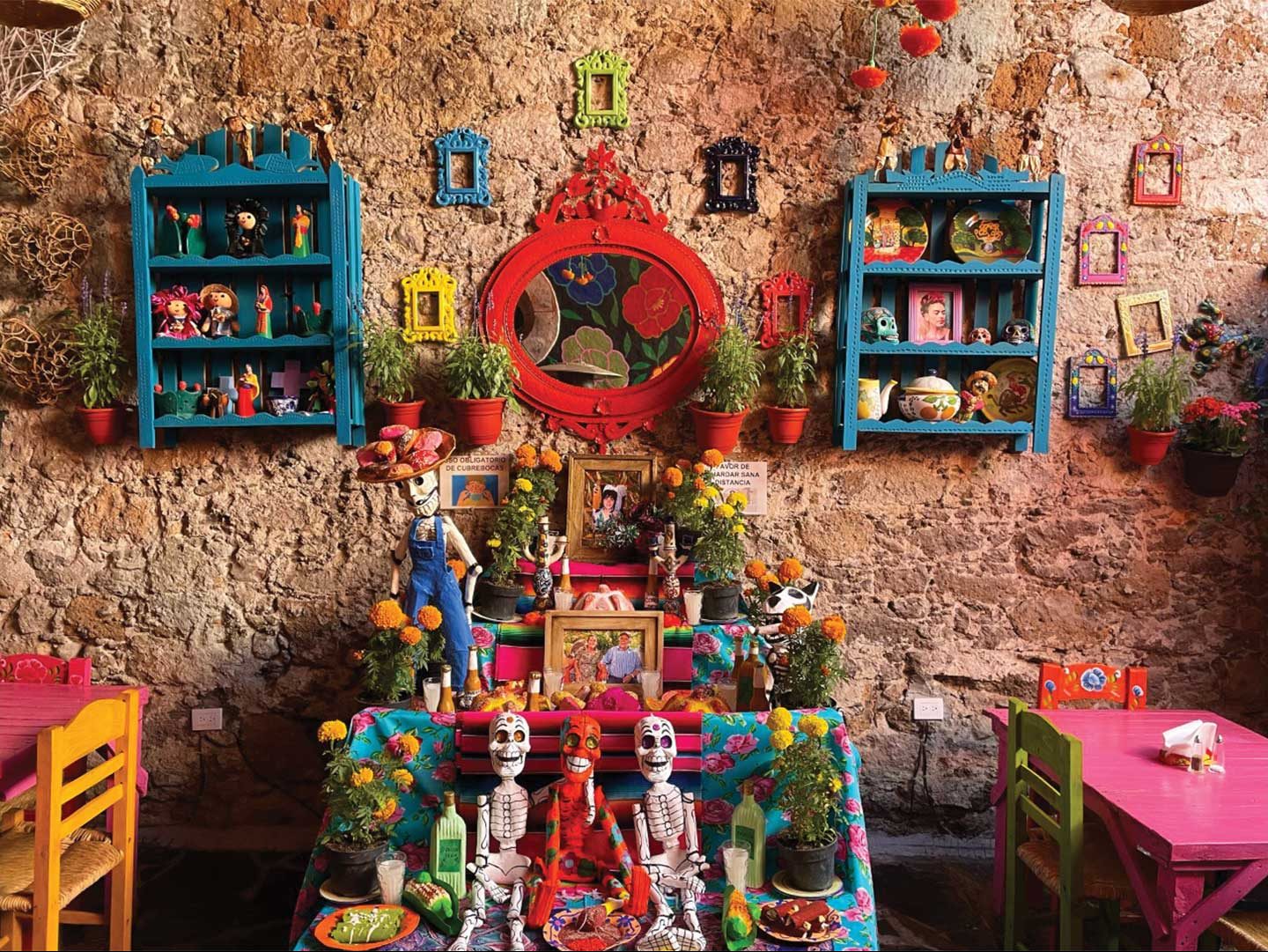 candles and other tokens on a shelf altar