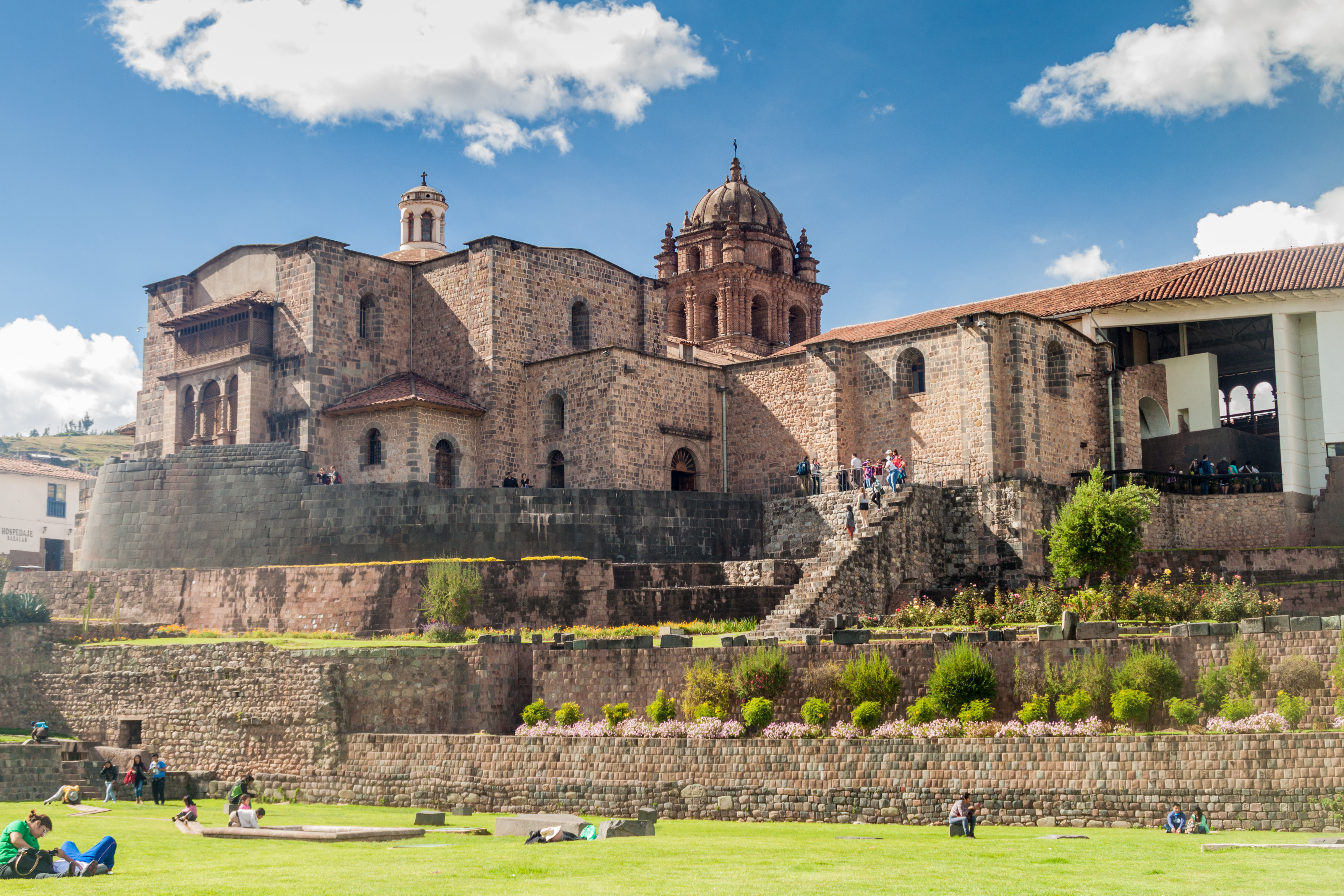 church built on top of ruins in front of walls and garden