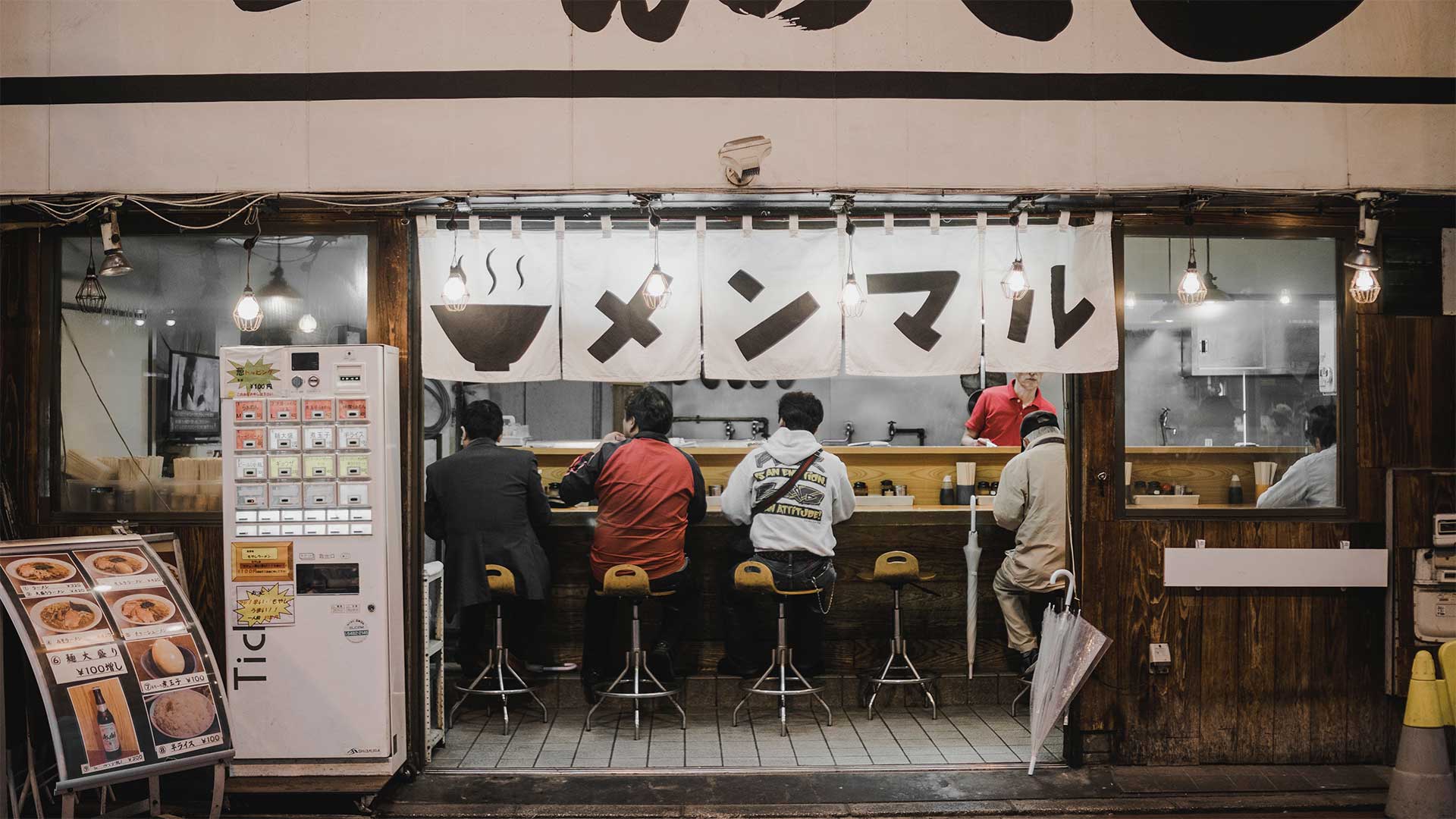 sushi restaurant with men sitting at the counter