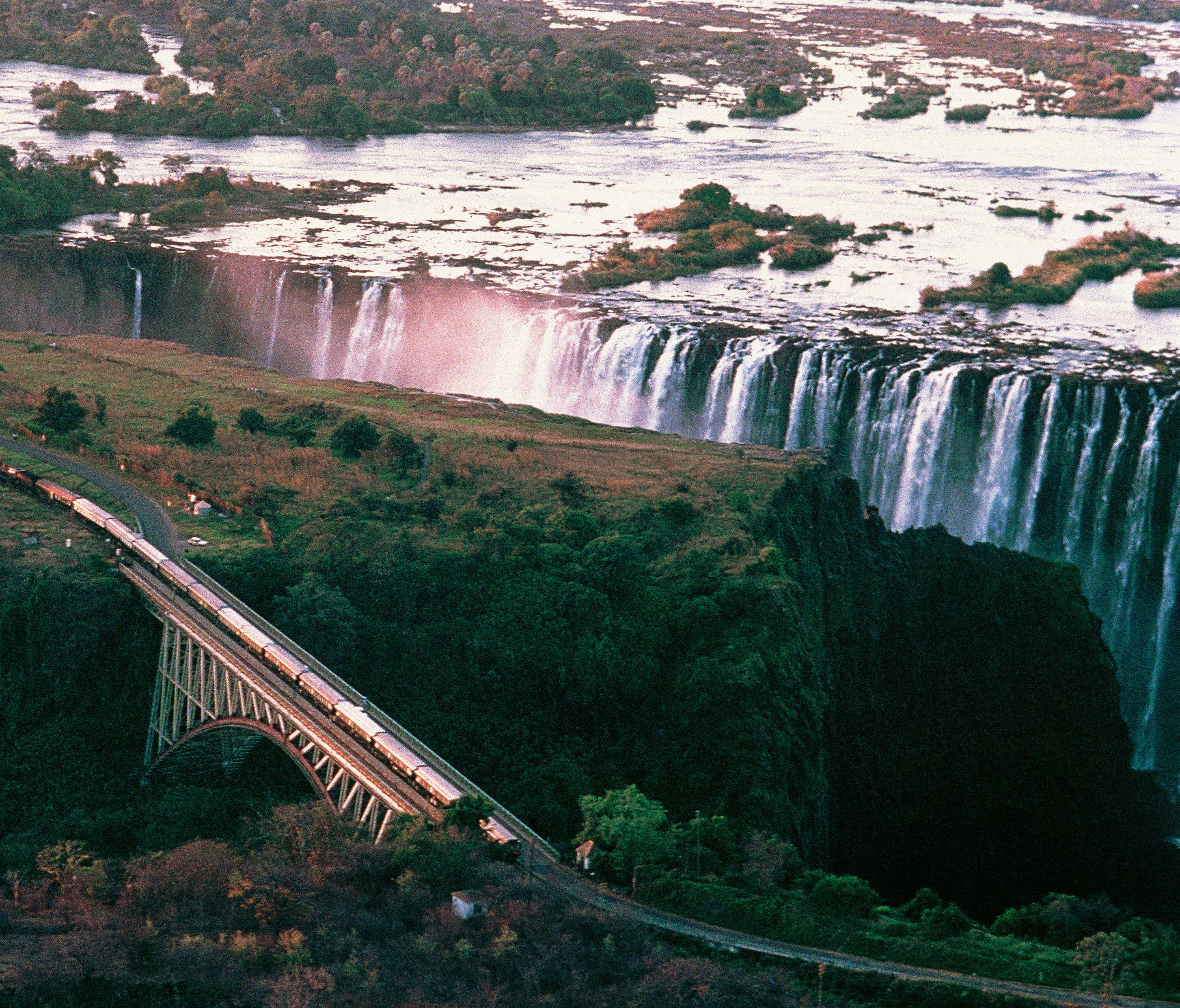 aerial view of the Rovos Rail train heading alongside Victoria Falls in Zimbabwe