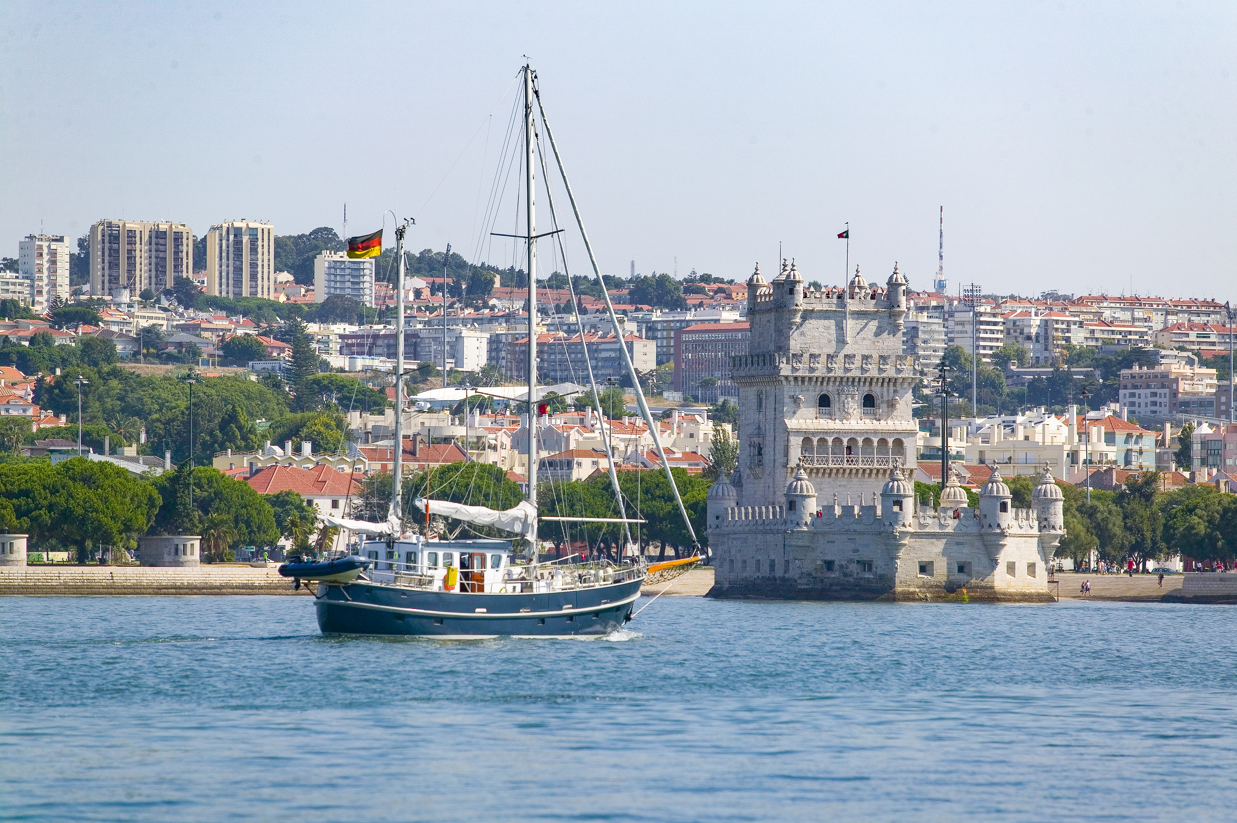 Yacht passing Belem Tower in Belem district, Lisbon, Portugal