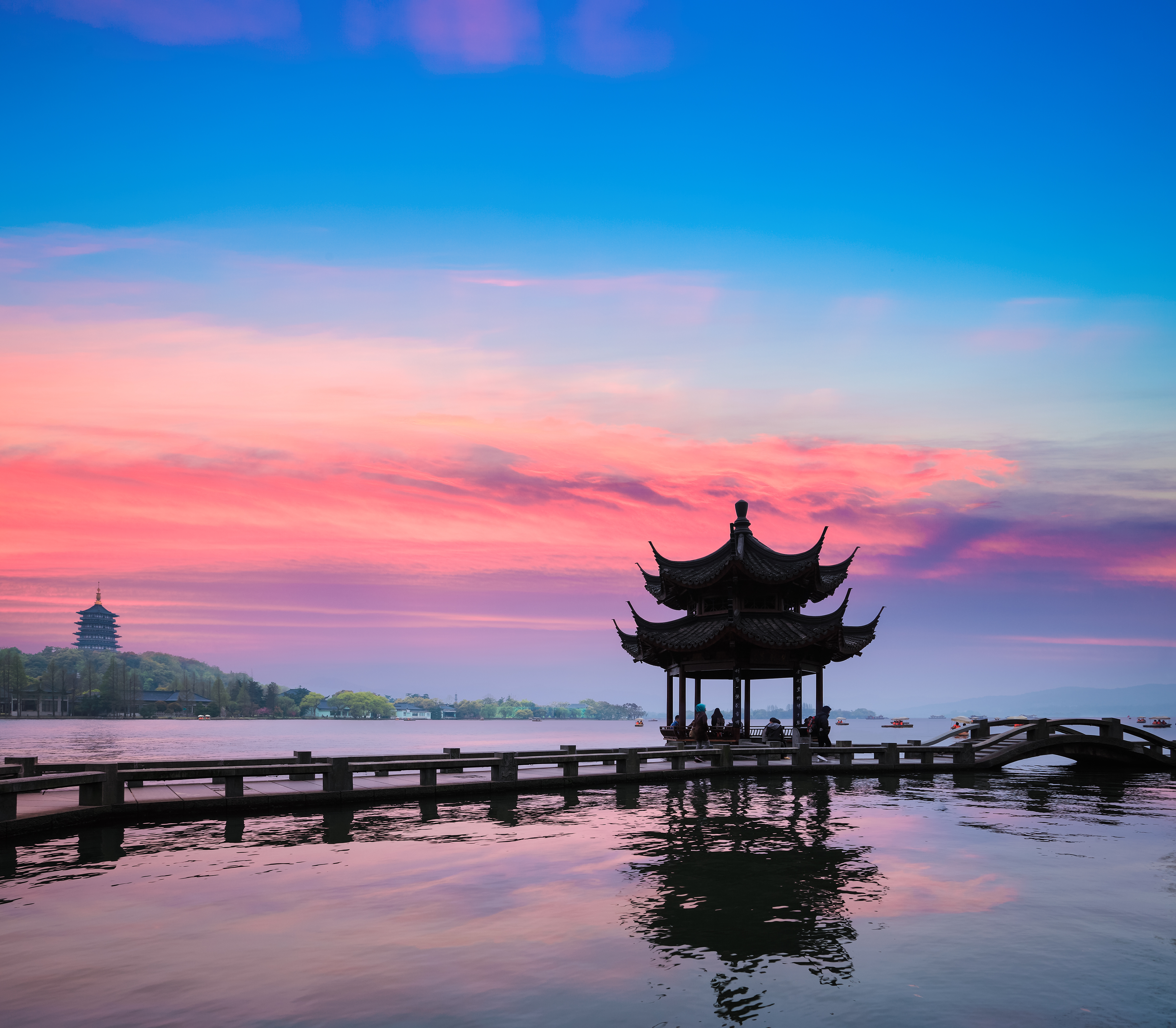 Ancient Pavilion Silhouette at Sunset on the West Lake in Hangzhou, China