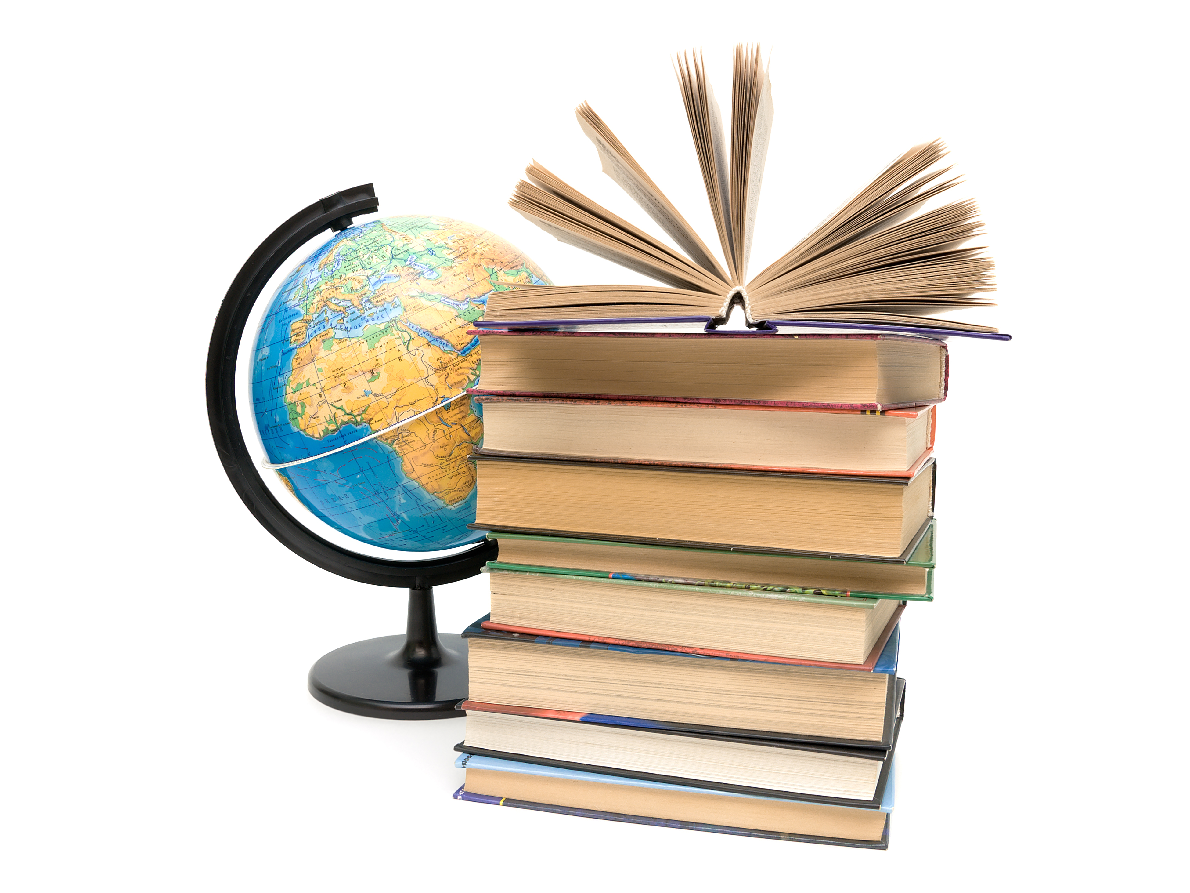 a globe next to a pile of books