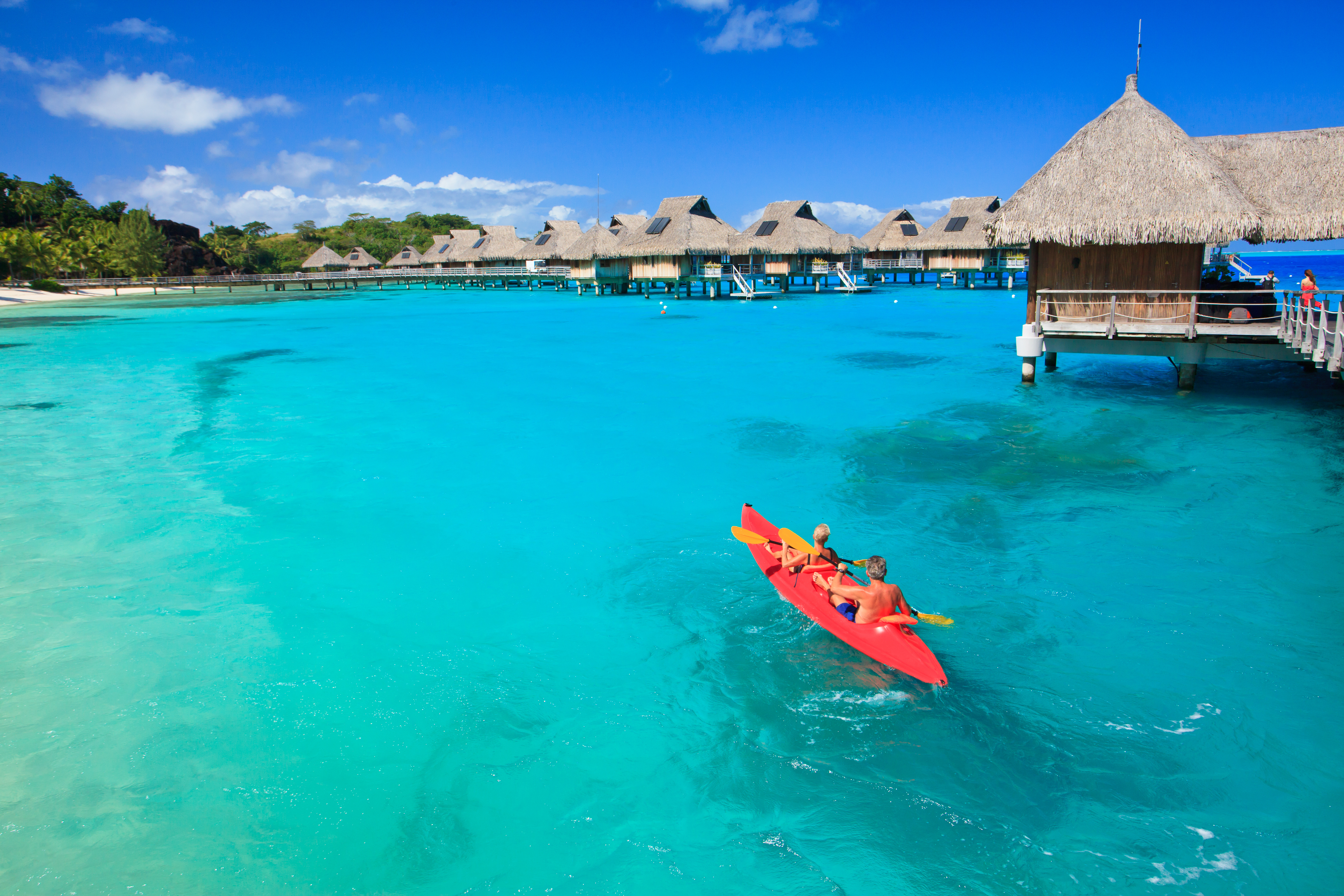 Couple Kayaking in the Blue Lagoon Bora Bora Tahiti French Polynesia South Pacific