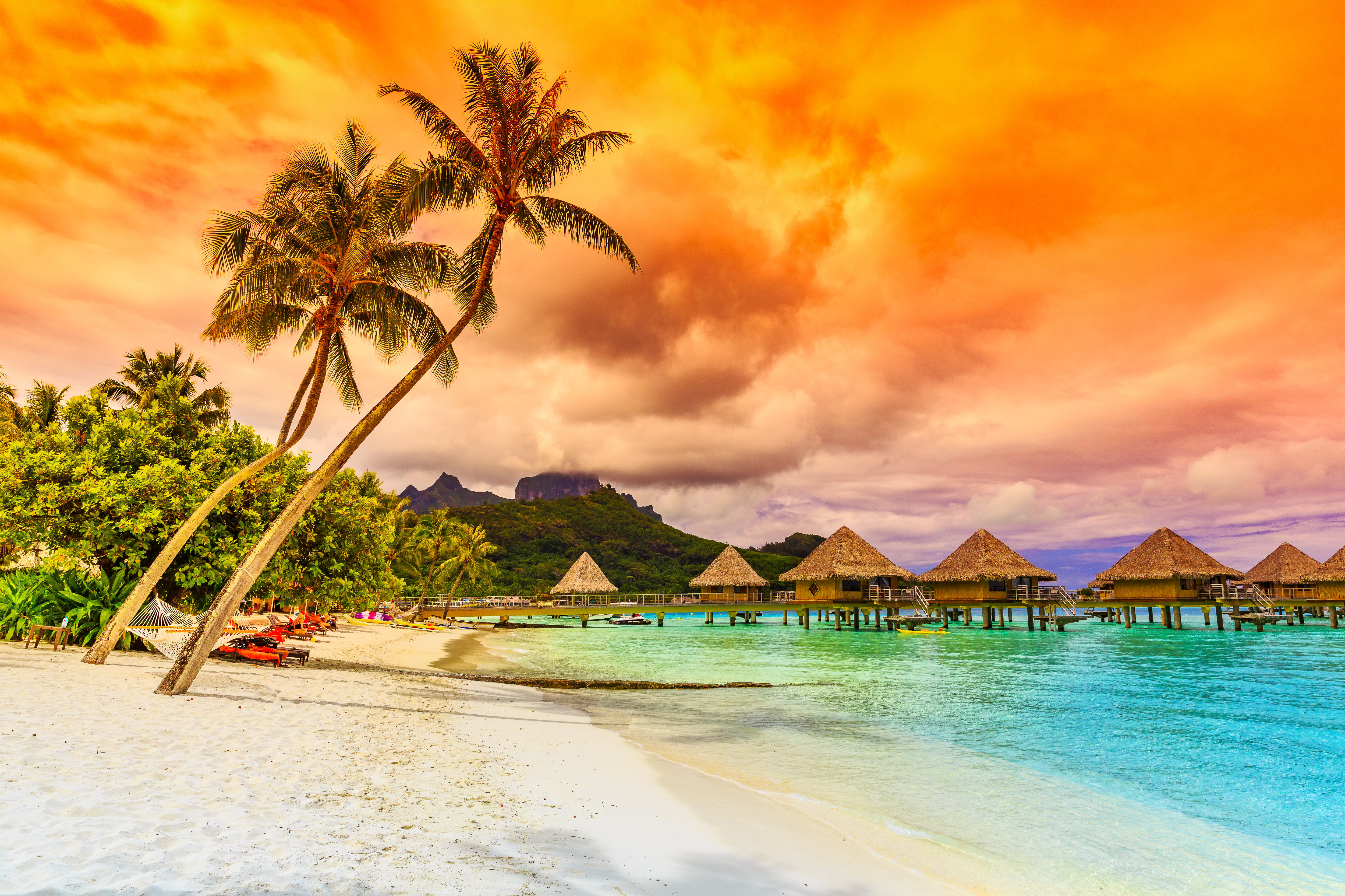 Bora Bora, French Polynesia. Otemanu mountain, beach and palm trees.