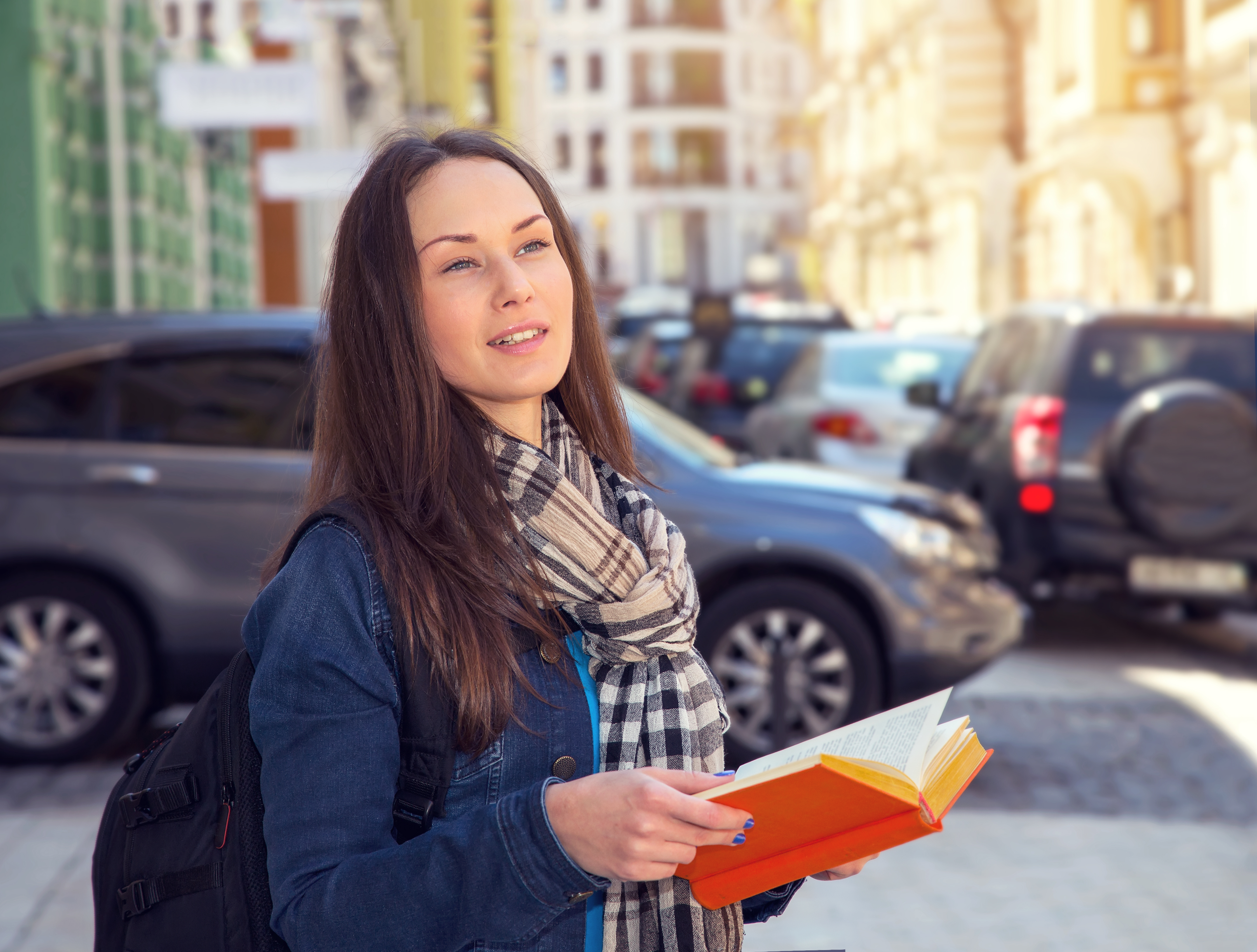 Young female traveller learning foreign languages in a different country.