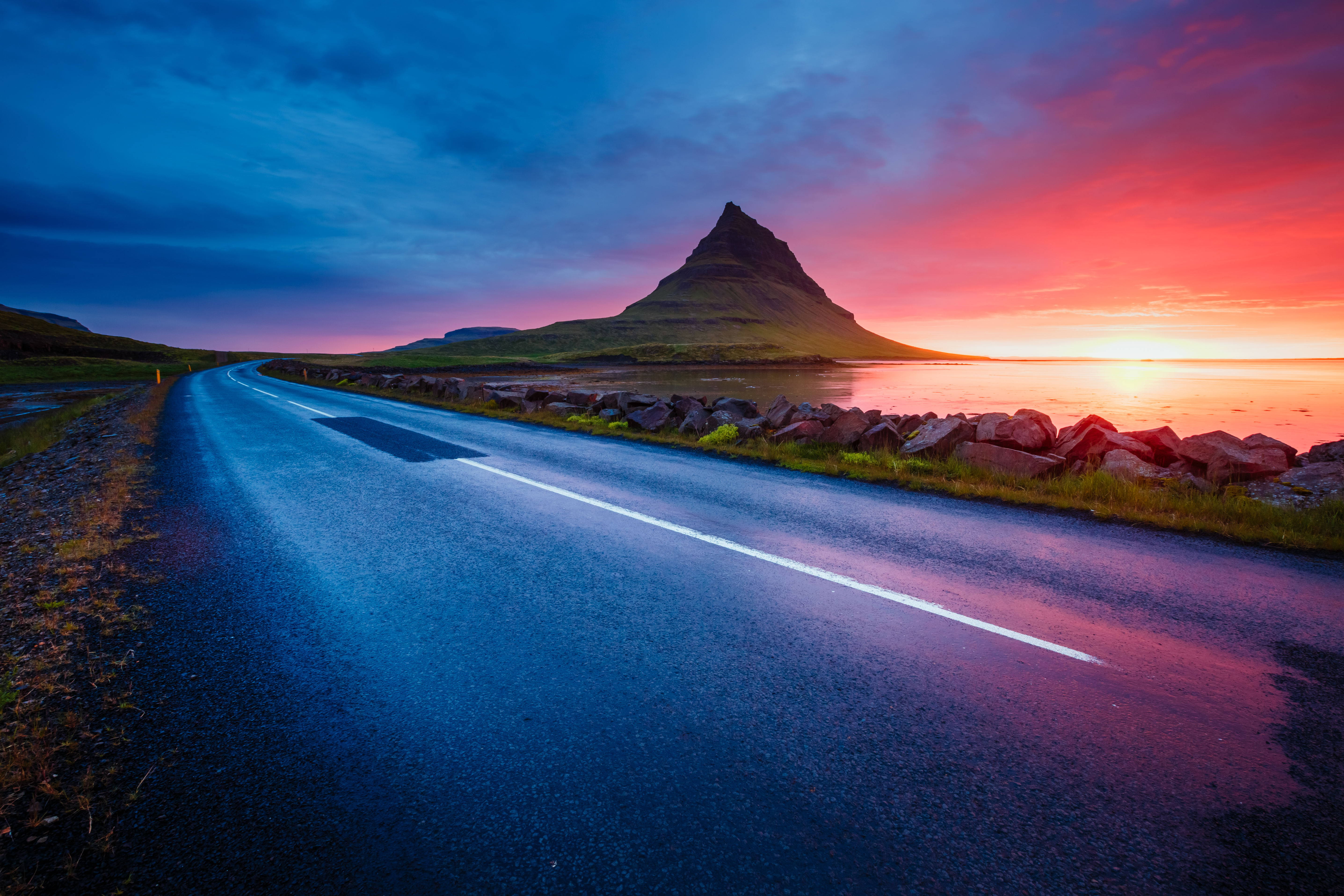 Kirkjufell volcano in the evening from the coast of Snaefellsnes Peninsula, Kirkjufellsfoss, Iceland