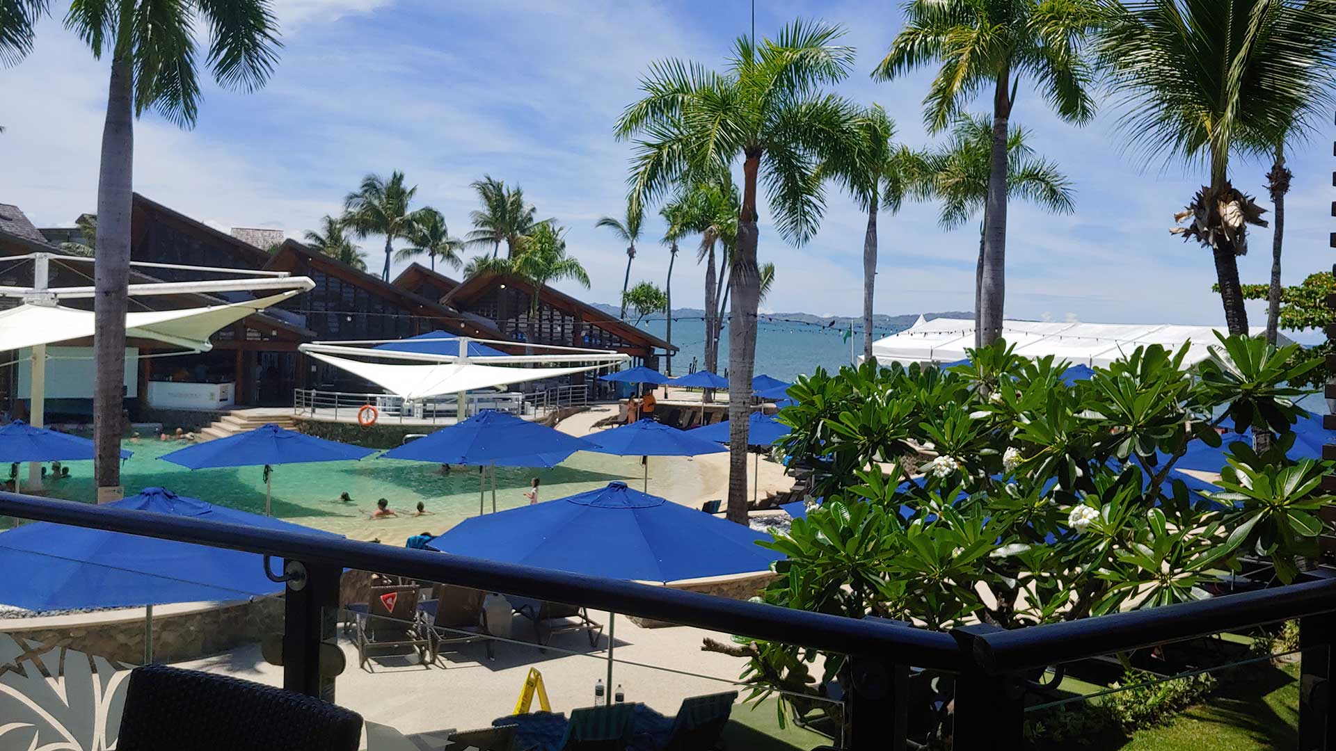 beach cabanas with palm trees