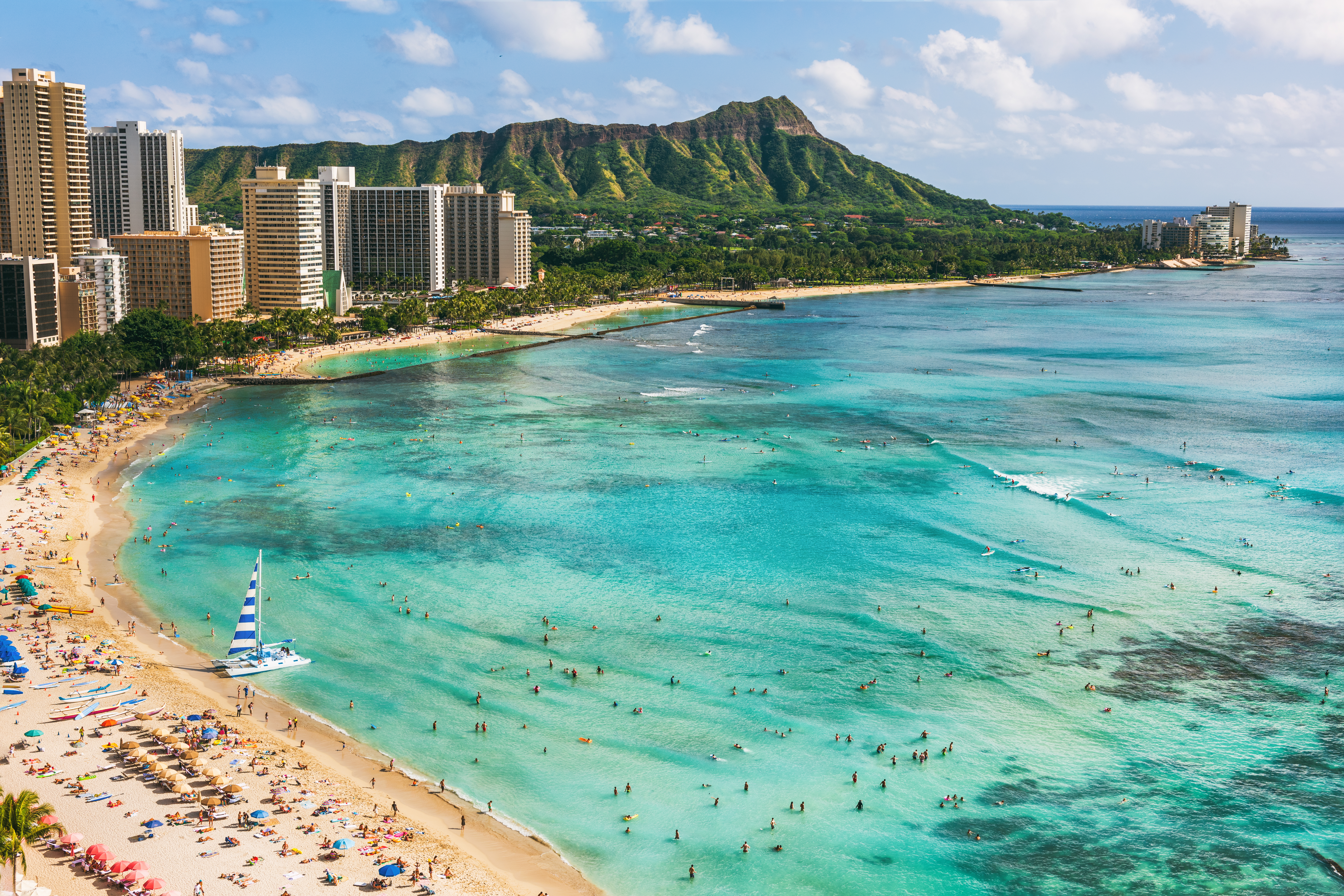 aerial view of the white sands and blue waters of Waikiki Beach in the capital of Honolulu on O'ahu, Hawai'i