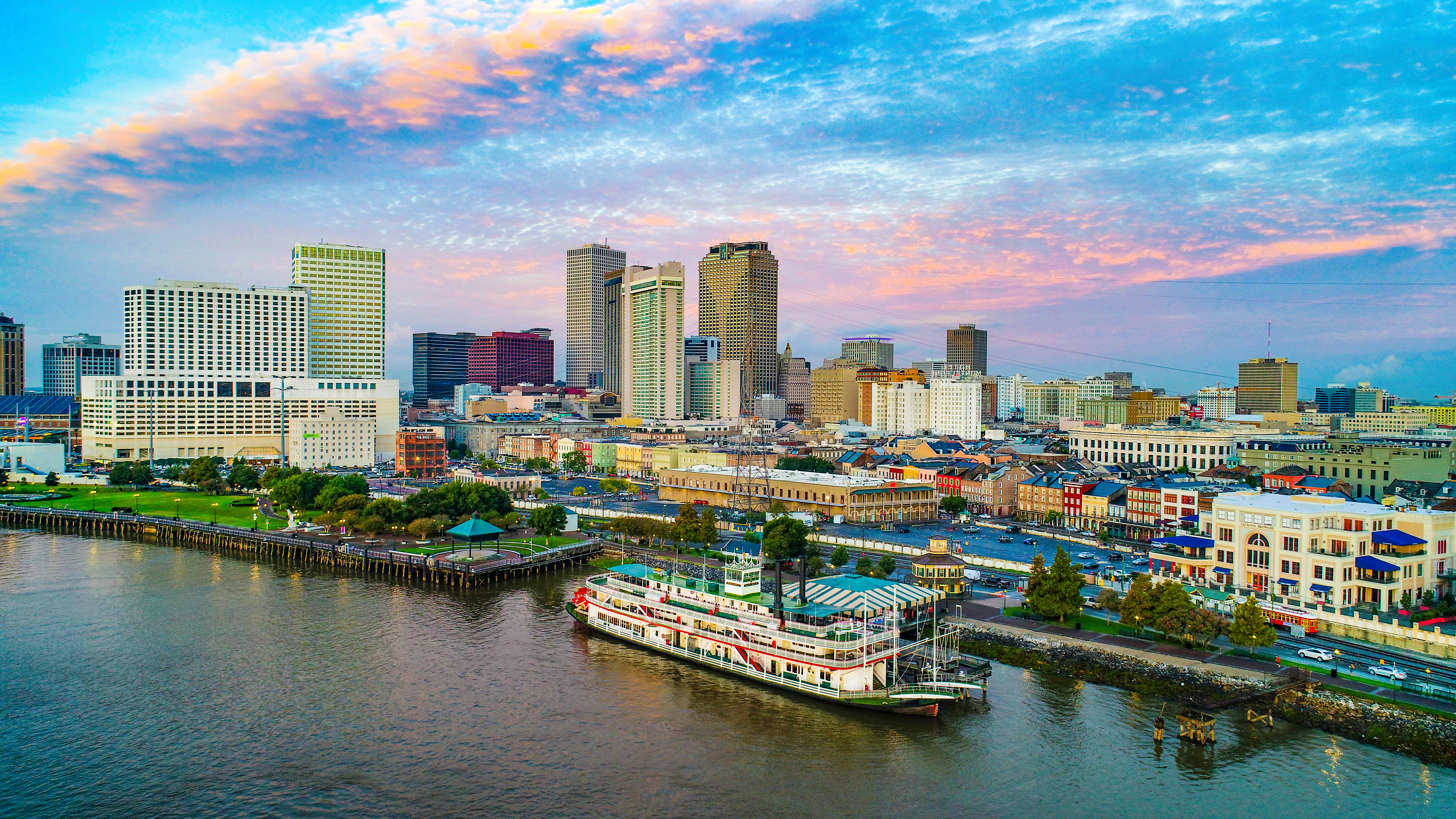 Skyline of city along the Mississippi river, steamboat in foreground