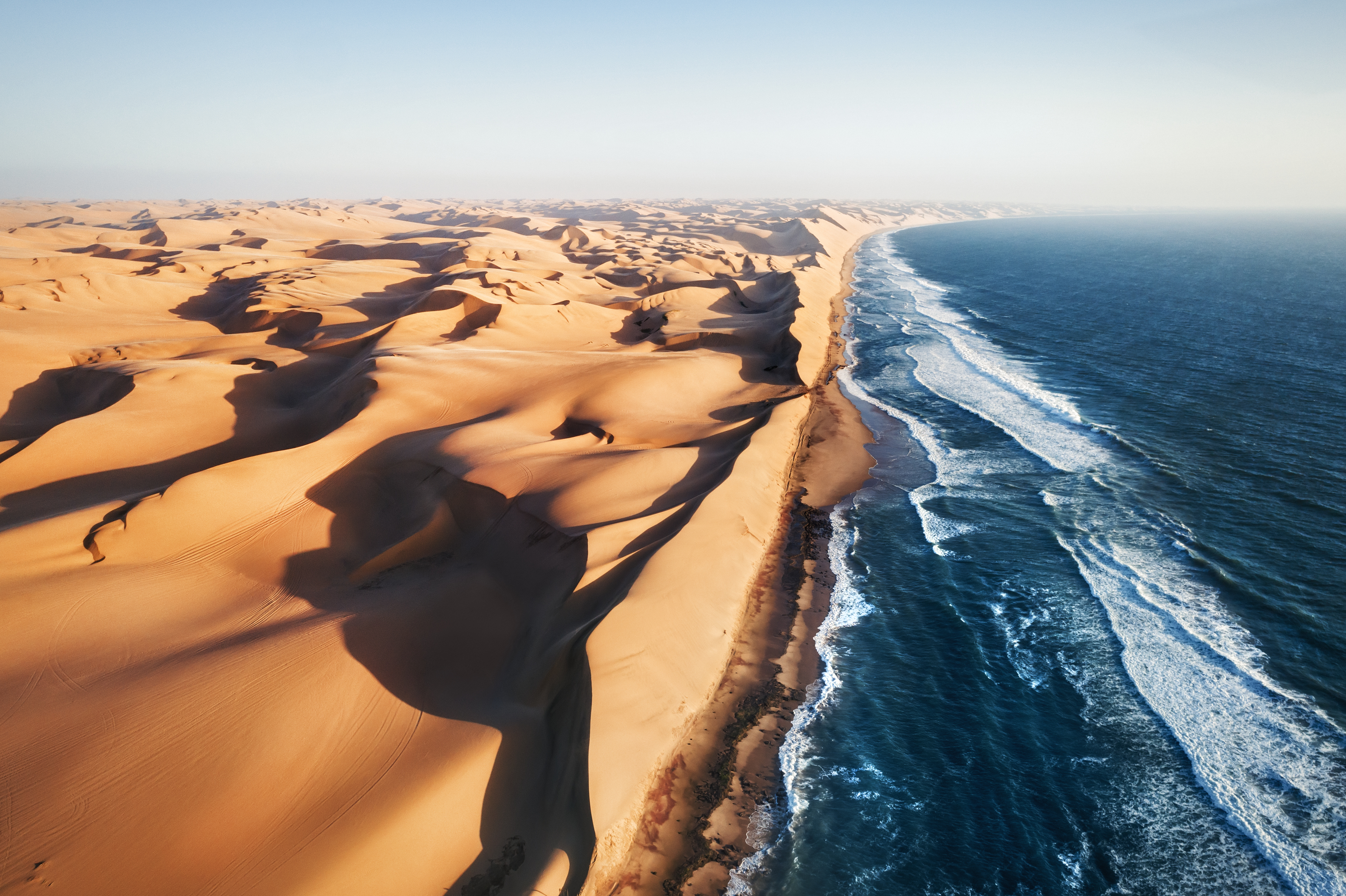 Aerial photo of where the Namib desert and the Atlantic ocean
