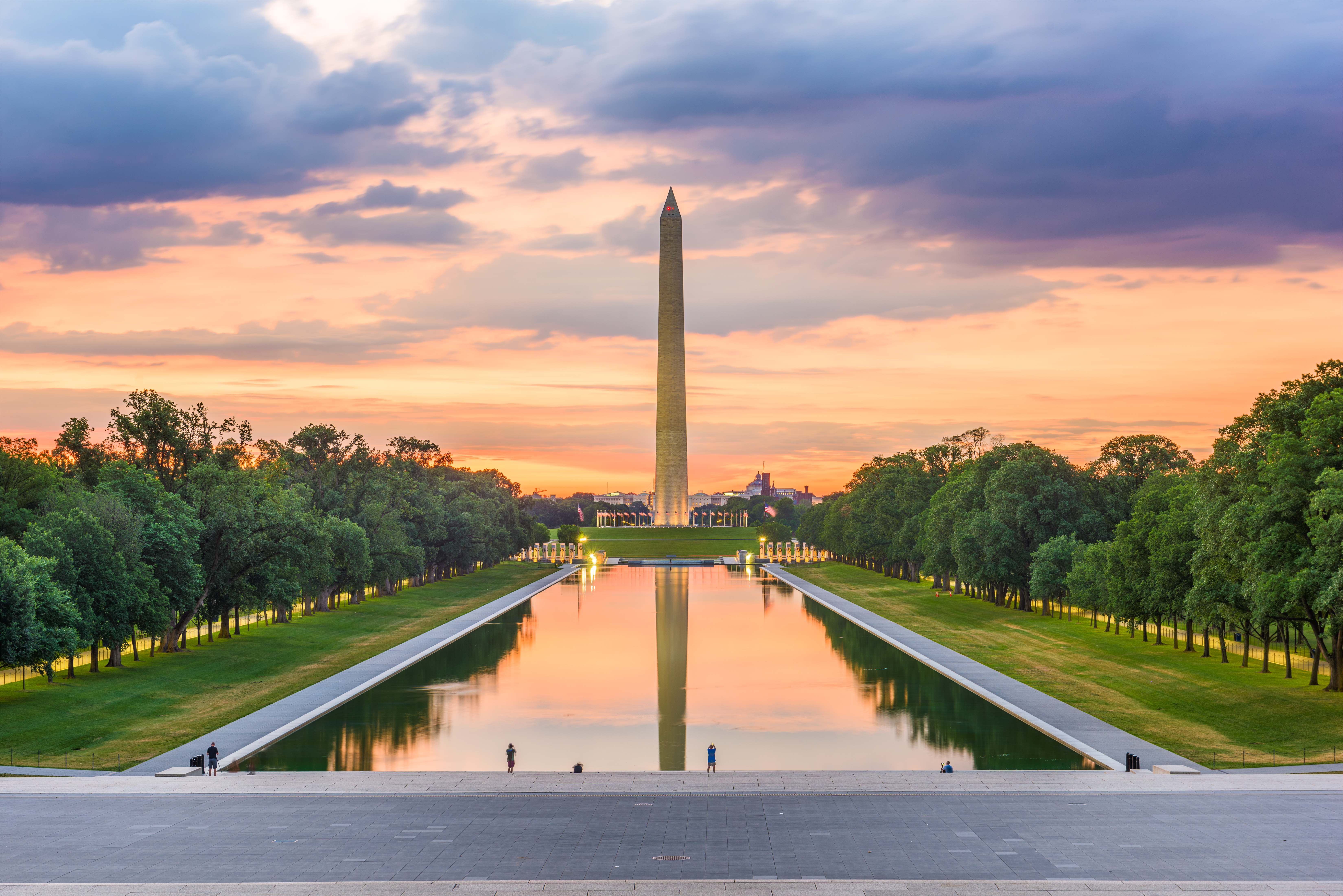 Monument reflecting on pool at dawn