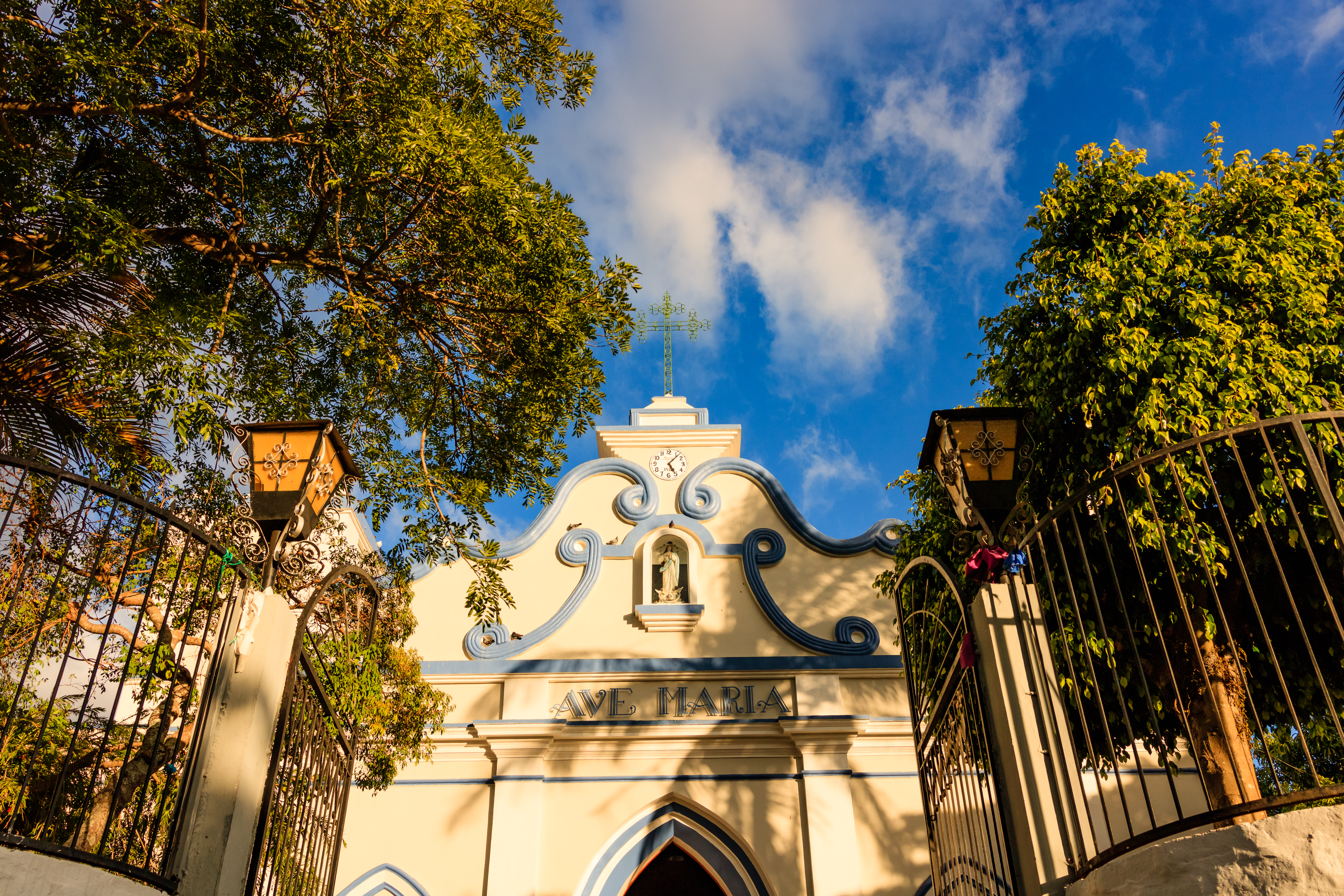 Sun shining over a small village colonial cathedral in El Salvador, Central America