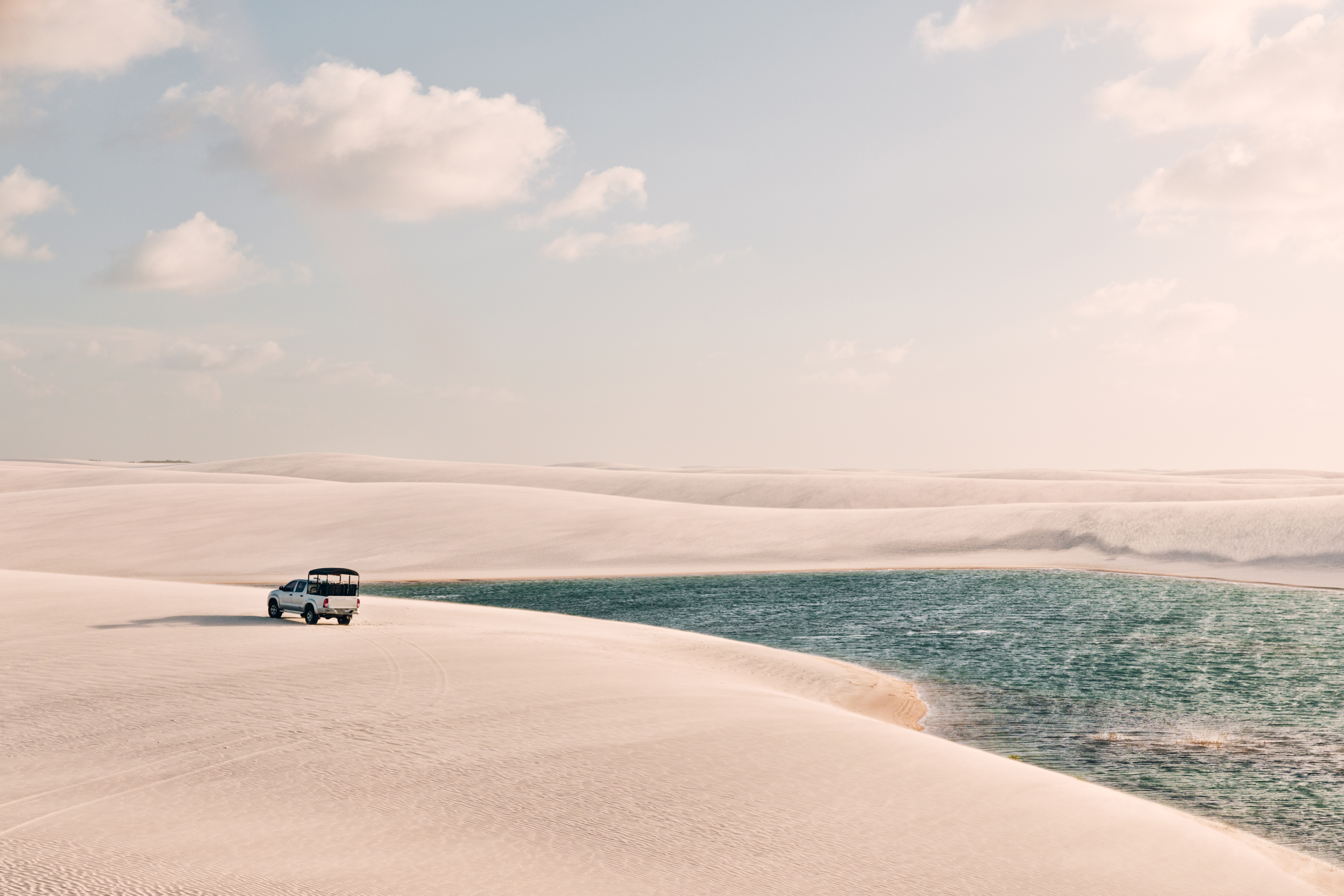 Off road car on the sand dunes of Lençois Maranhenses National Park in Maranhão