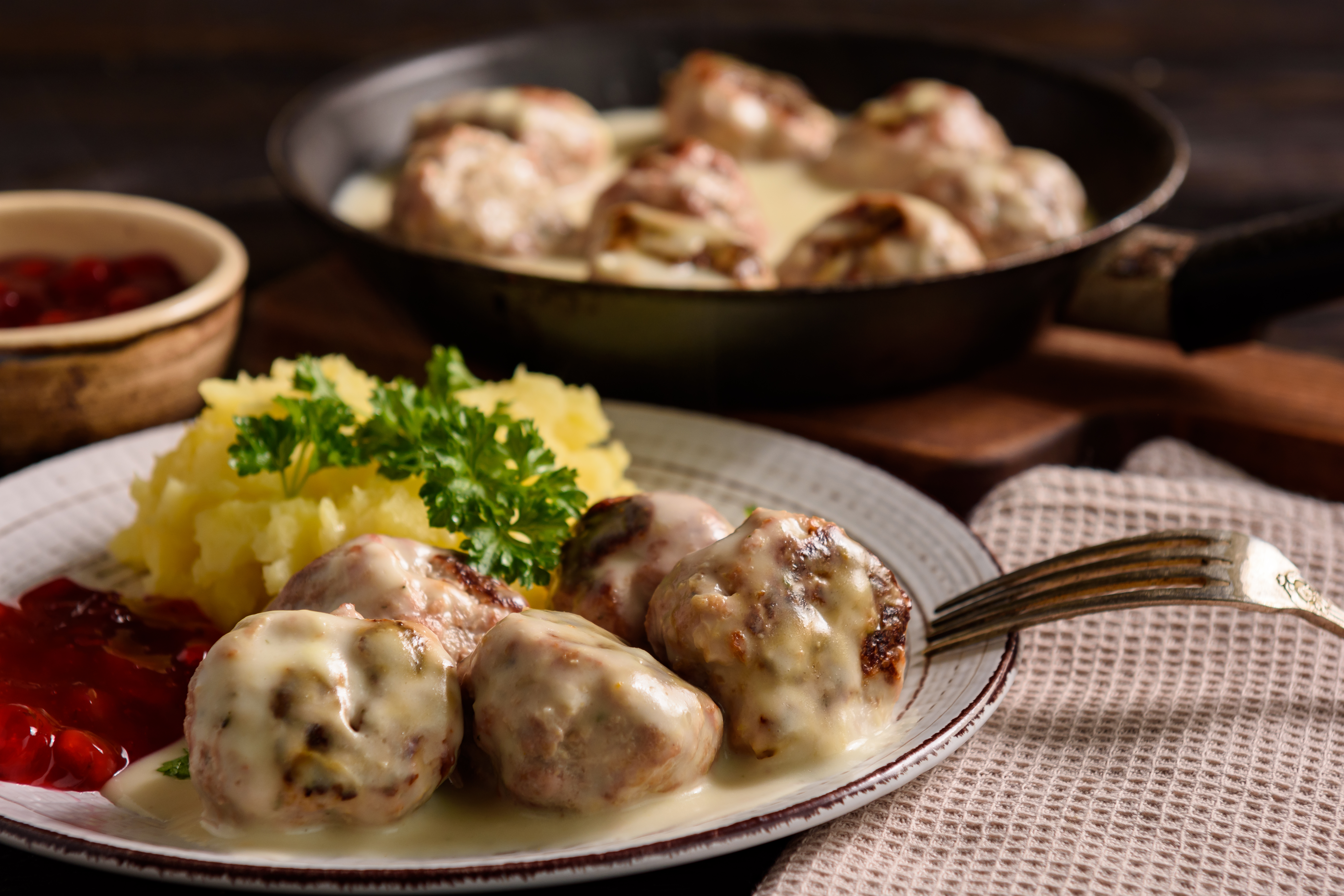 Swedish meatballs with creamy gravy, mashed potatoes and lingonberry sauce.