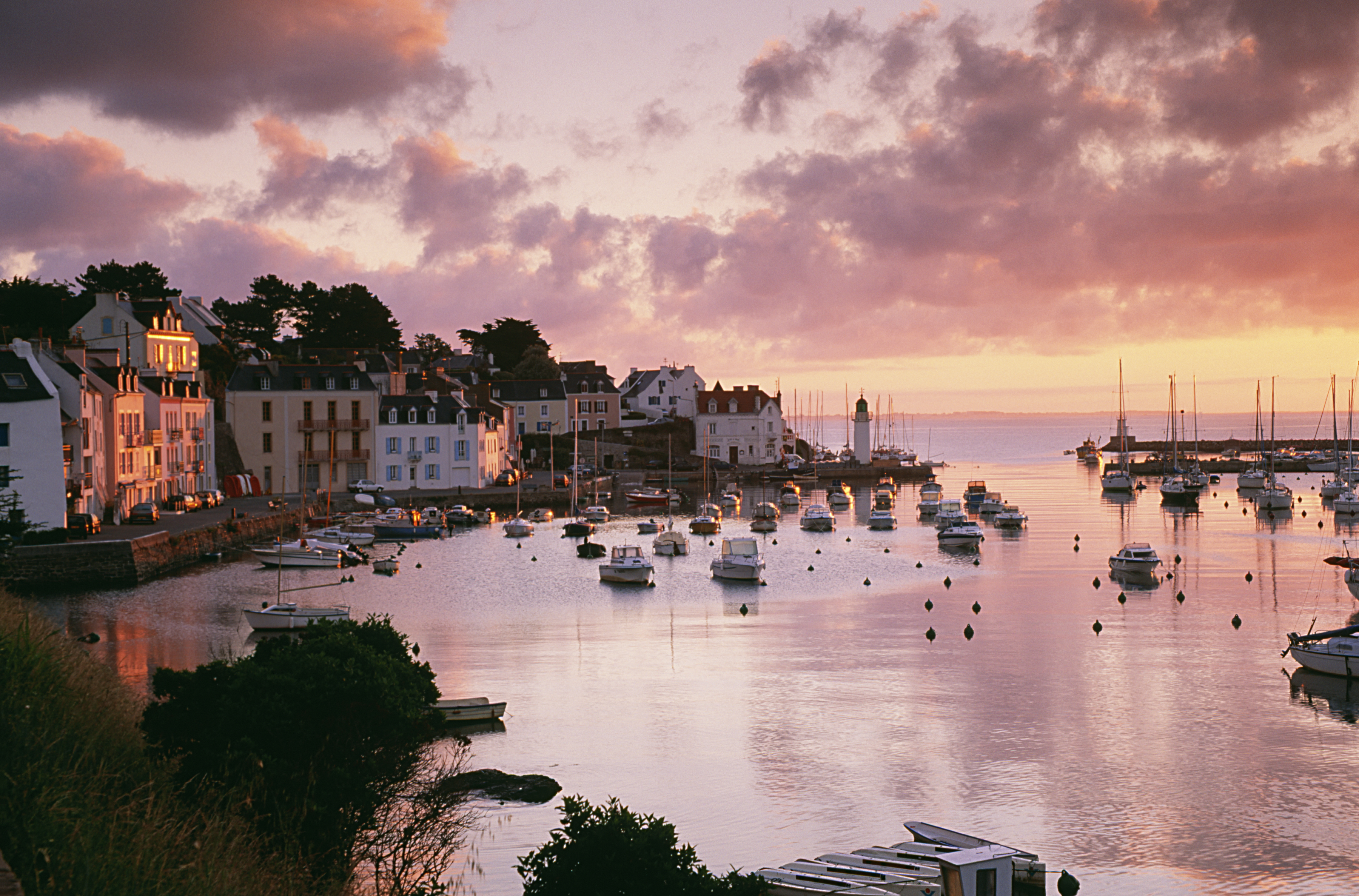 Harbour with boats in the water at sunset
