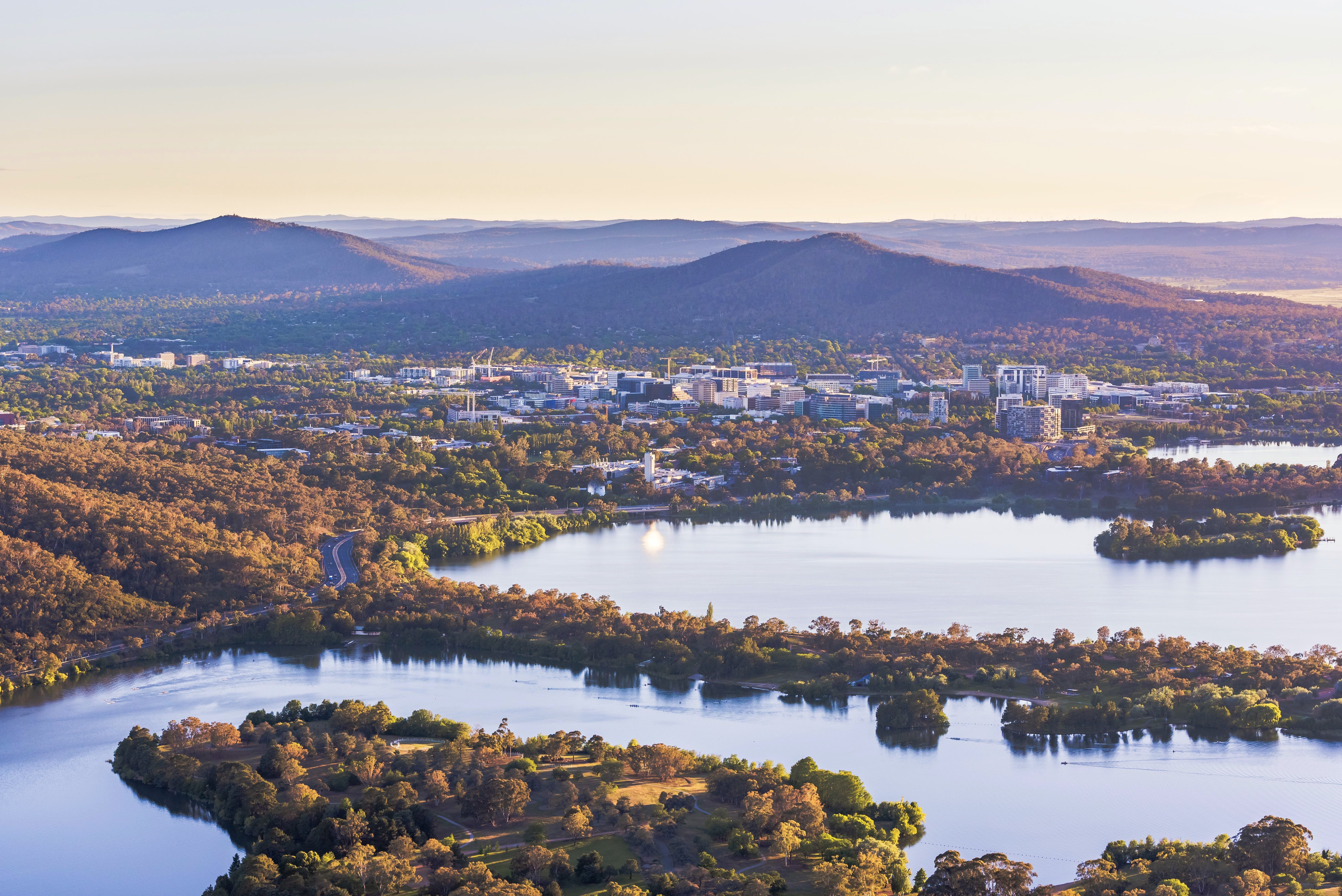 Aerial view of Canberra Central Business District with sunrise at Lake Burley Griffin