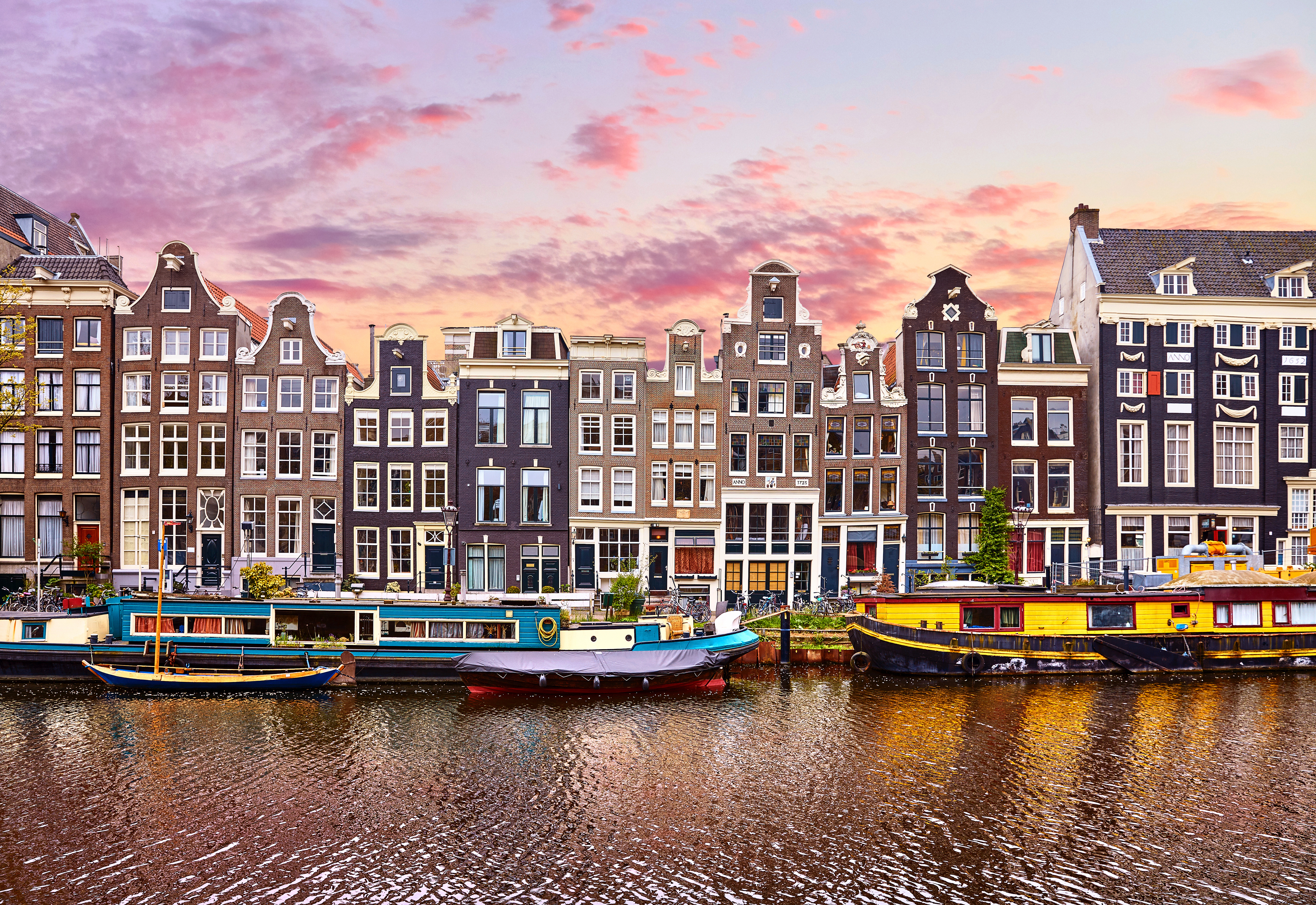 Floating Houses and houseboats and boats at channels by banks